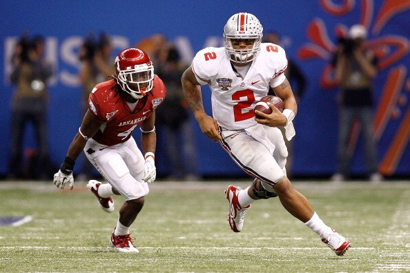 NEW ORLEANS, LA - JANUARY 04:  Quarterback Terrelle Pryor #2 of the Ohio State Buckeyes runs with the ball in front of Rudell Crim #4 of the Arkansas Razorbacks during the Allstate Sugar Bowl at the Louisiana Superdome on January 4, 2011 in New Orleans, L