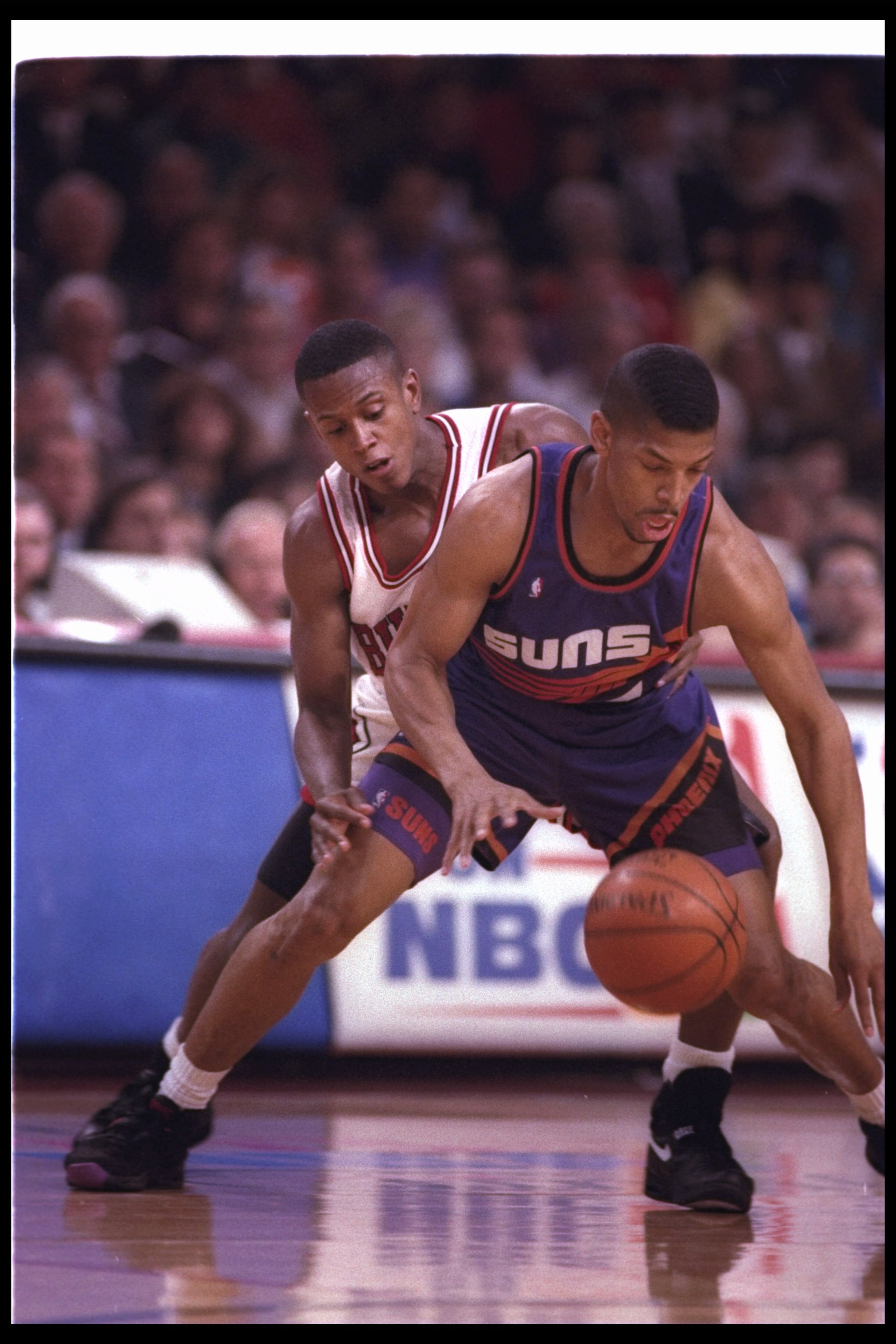 16 Jun 1993: Guard Kevin Johnson of the Phoenix Suns moves the ball during a game against the Chicago Bulls at the America West Arena in Phoenix, Arizona. 16 Jun 1993: Guard Kevin Johnson of the Phoenix Suns moves the ball during a game against the Chicago Bulls at the America West Arena in Phoenix, Arizona.