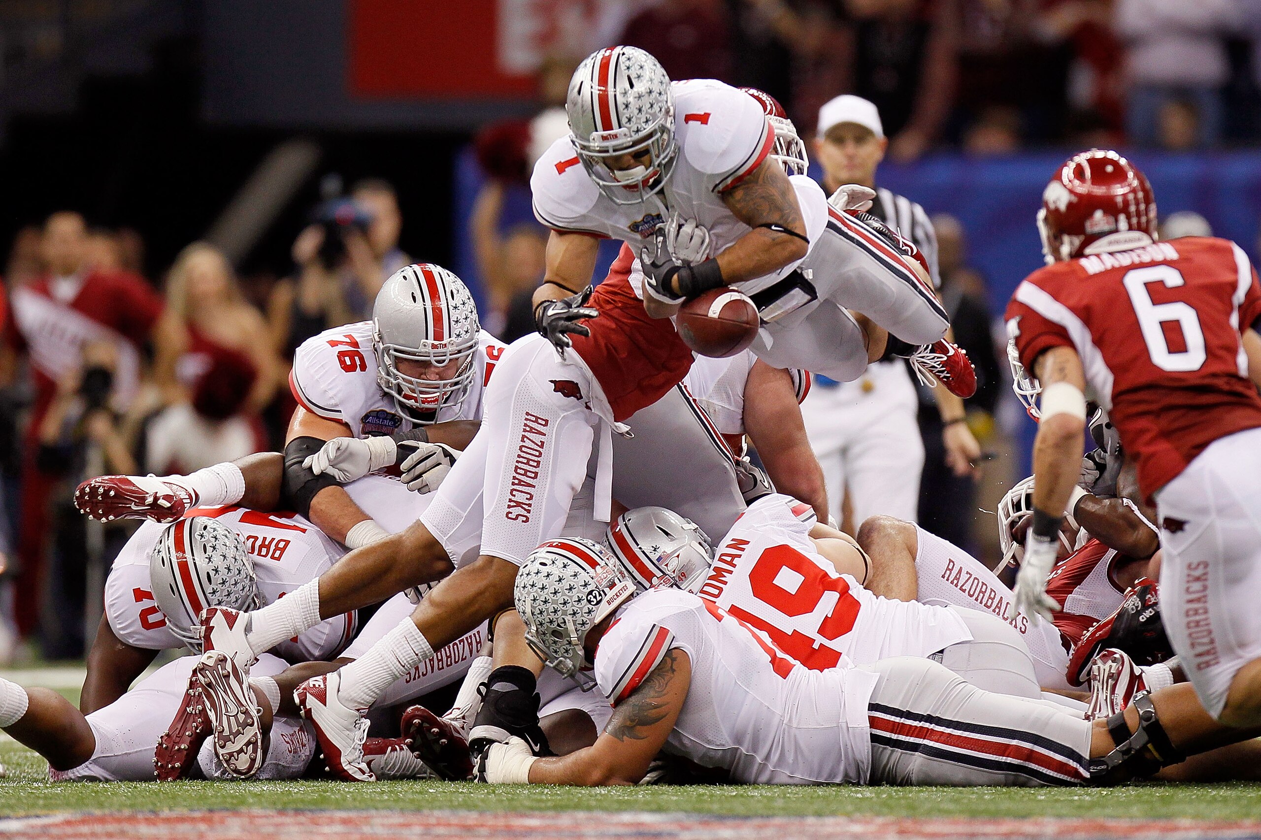 NEW ORLEANS, LA - JANUARY 04: Dan Herron #1 of the Ohio State Buckeyes fumbles the football in the fourth quarter agianst the Arkansas Razorbacks during the Allstate Sugar Bowl at the Louisiana Superdome on January 4, 2011 in New Orleans, Louisiana. (Ph NEW ORLEANS, LA - JANUARY 04: Dan Herron #1 of the Ohio State Buckeyes fumbles the football in the fourth quarter agianst the Arkansas Razorbacks during the Allstate Sugar Bowl at the Louisiana Superdome on January 4, 2011 in New Orleans, Louisiana. (Ph