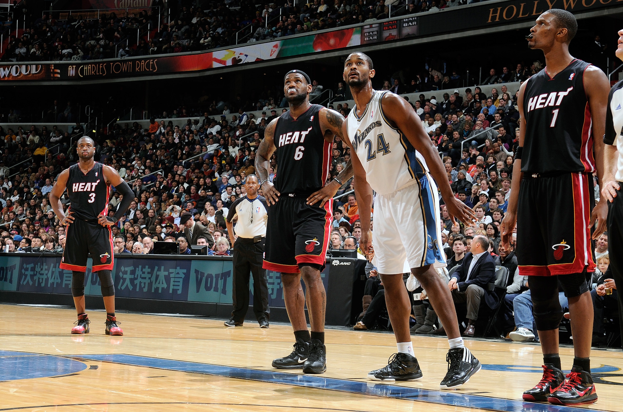 WASHINGTON, DC - DECEMBER 18:  LeBron James #6, Dwyane Wade #3 and Chris Bosh #1 of the Miami Heat and Hilton Armstrong #24 of the Washington Wizards wait for a free throw attempt at the Verizon Center on December 18, 2010 in Washington, DC. NOTE TO USER: