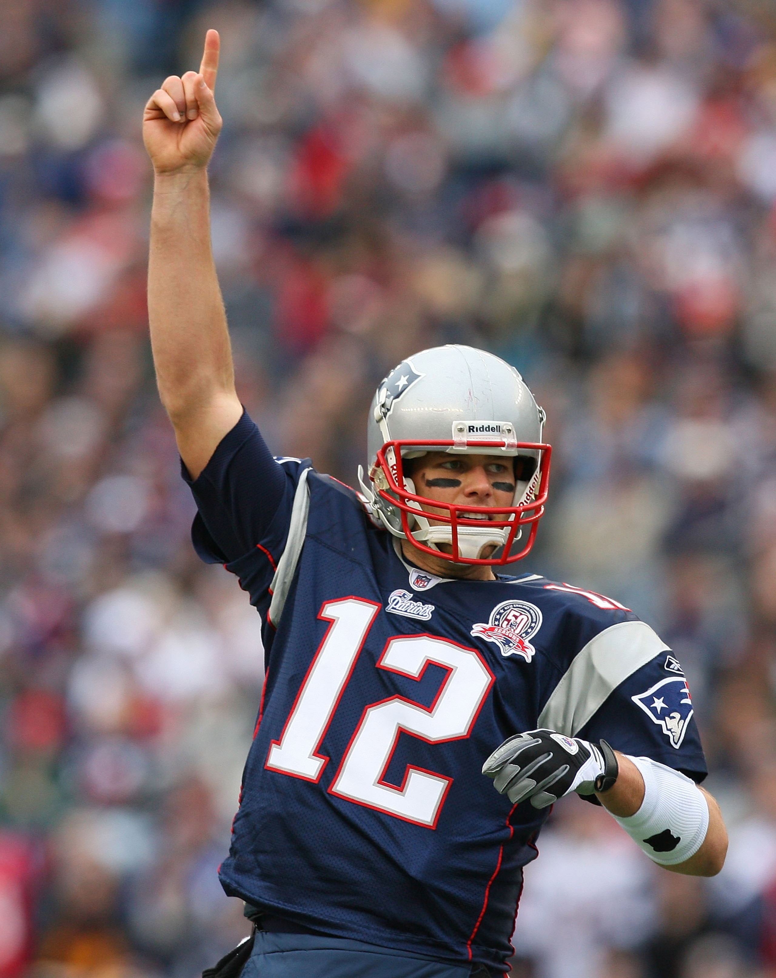 FOXBORO, MA - DECEMBER 27:  Tom Brady #12 of the New England Patriots reacts prematurely in the first quarter against the Jacksonville Jaguars at Gillette Stadium on December 27, 2009 in Foxboro, Massachusetts.  Runner back Laurence Maroney #39 of the New