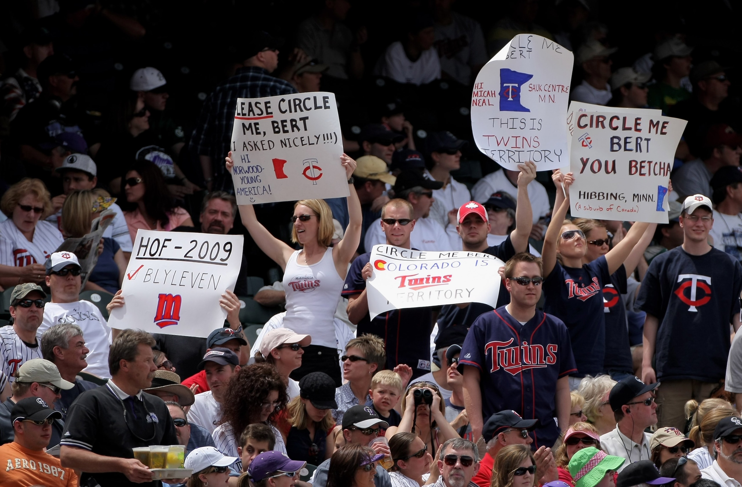 DENVER - MAY 18:  Minnesota Twins fans use signs to encourage television commentator Bert Blyleven to circle them on the telestrator as the Twins face the Colorado Rockies during Interleague MLB action at Coors Field on May 18, 2008 in Denver, Colorado. T
