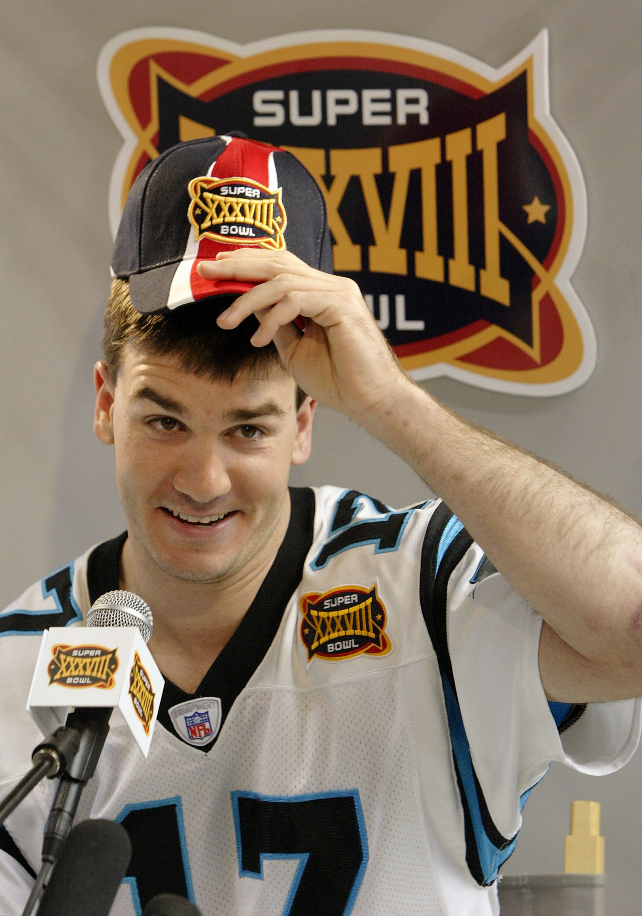 HOUSTON - JANUARY 27:  Quarterback Jake Delhomme #17 of the Carolina Panthers answers questions on media day January 26, 2003 at Reliant Stadium before Super Bowl XXXVIII against the New England Patriots in Houston, Texas.  (Photo by Brian Bahr/Getty Imag