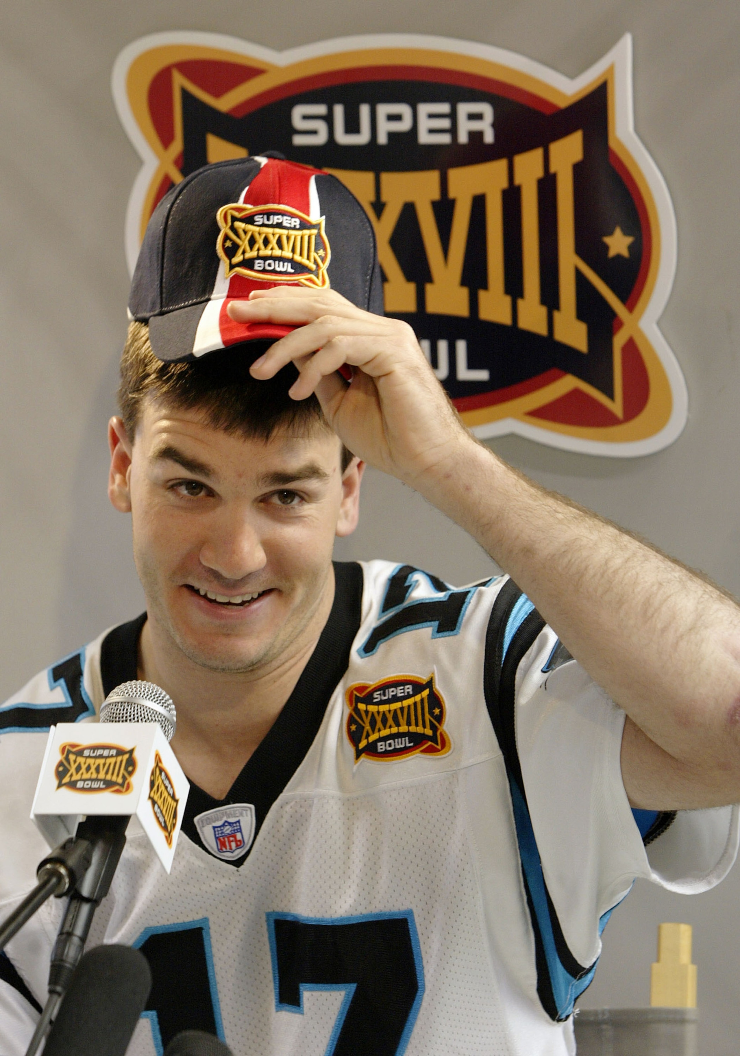 HOUSTON - JANUARY 27:  Quarterback Jake Delhomme #17 of the Carolina Panthers answers questions on media day January 26, 2003 at Reliant Stadium before Super Bowl XXXVIII against the New England Patriots in Houston, Texas.  (Photo by Brian Bahr/Getty Imag