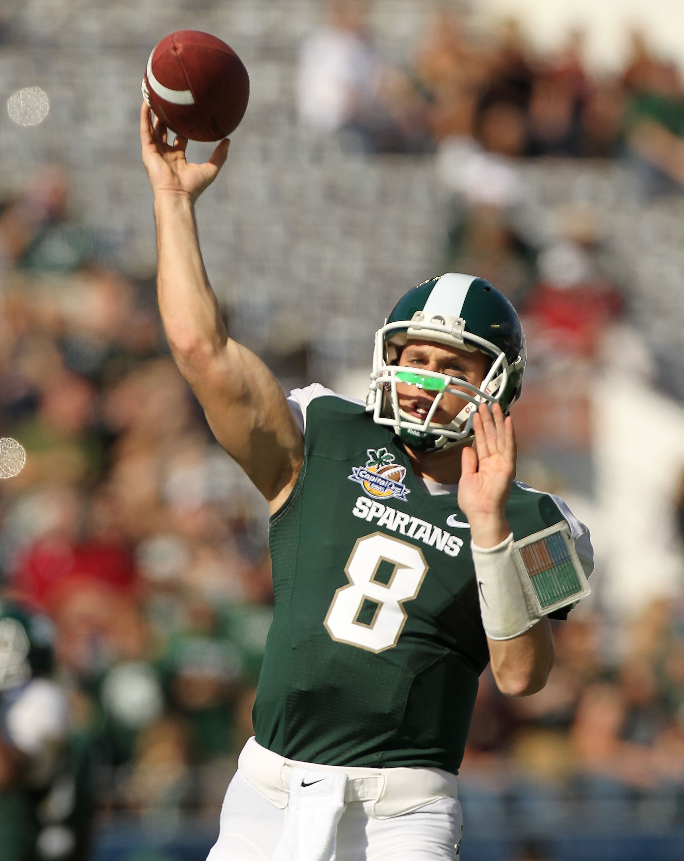 ORLANDO, FL - JANUARY 01: Kirk Cousins #8  of the Michigan State Spartans warms up during the Capitol One Bowl against the Alabama Crimson Tide at the Florida Citrus Bowl on January 1, 2011 in Orlando, Florida.  (Photo by Mike Ehrmann/Getty Images)