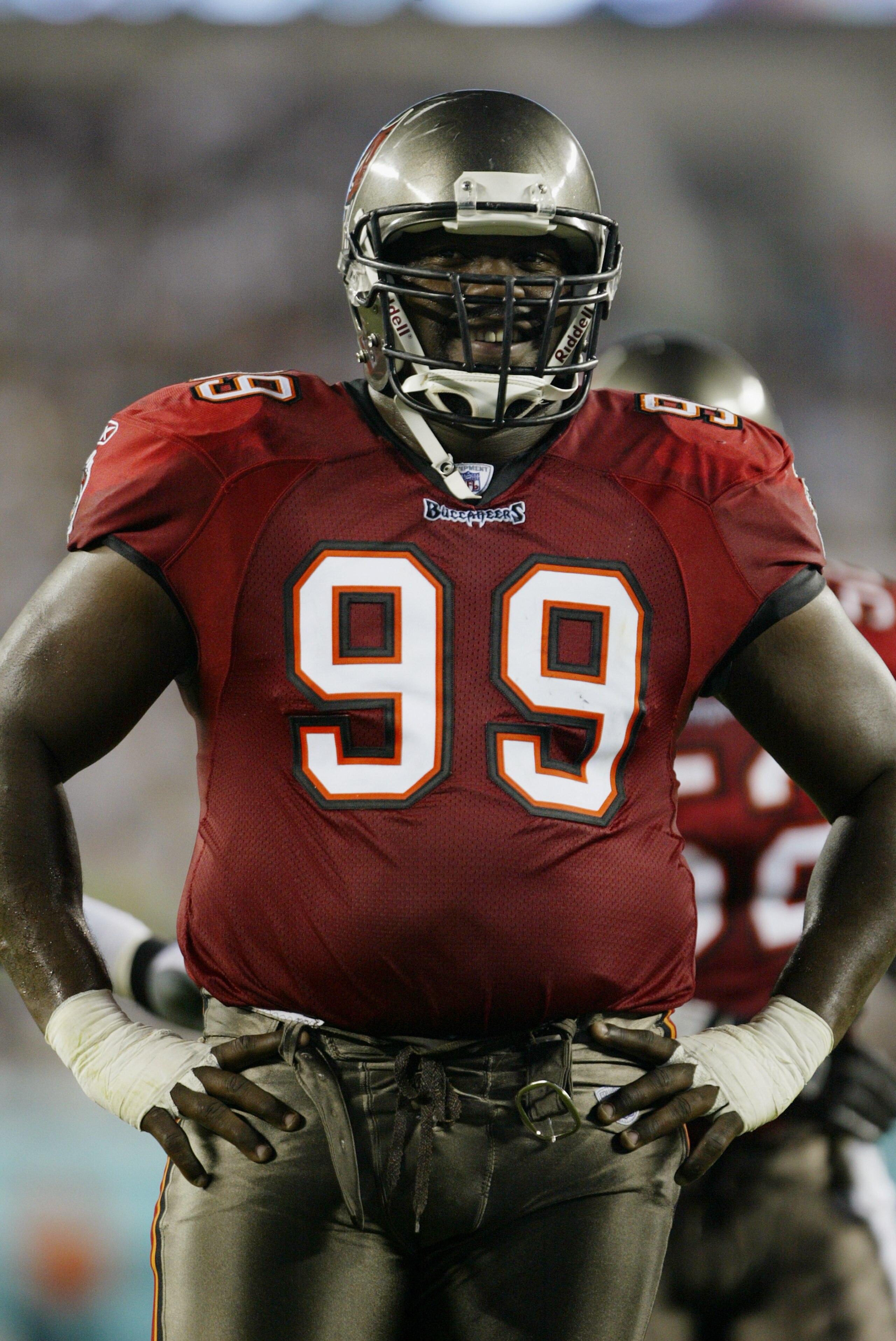 PHILADELPHIA - SEPTEMBER 8: Warren Sapp #99 of the Tampa Bay Buccaneers smiles during the game against the Philadelphia Eagles on September 8, 2003 at Lincoln Financial Field in Philadelphia, Pennsylvania. The Buccaneers defeated the Eagles 17-0 in the PHILADELPHIA - SEPTEMBER 8: Warren Sapp #99 of the Tampa Bay Buccaneers smiles during the game against the Philadelphia Eagles on September 8, 2003 at Lincoln Financial Field in Philadelphia, Pennsylvania. The Buccaneers defeated the Eagles 17-0 in the