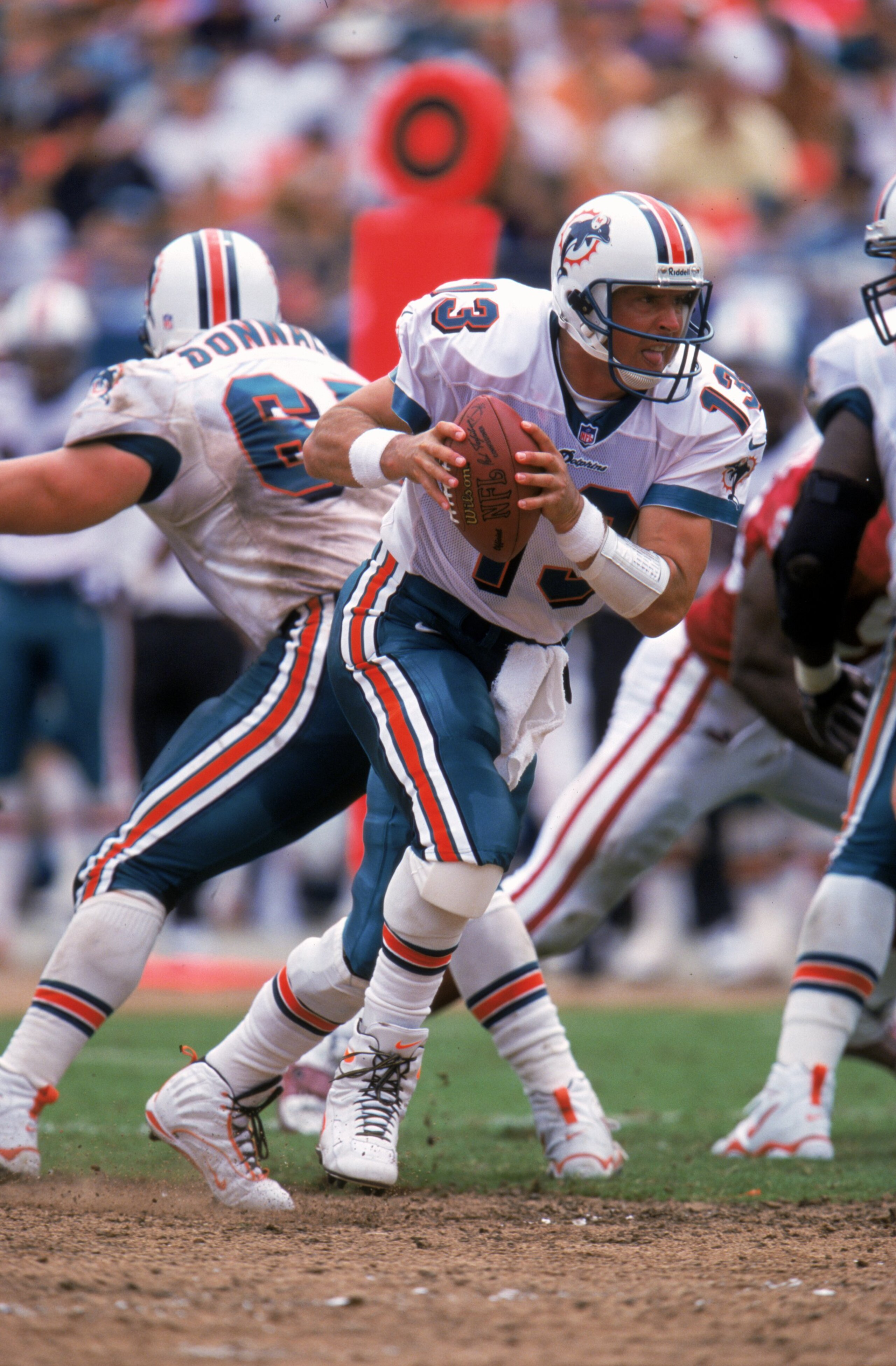 19 Sep 1999: Dan Marino #13 of the Miami Dolphins moves with the ball during the game against the Arizona Cardinals at the Pro Players Stadium in Miami, Florida. The Dolphins defeated the Cardinals 19-16. 19 Sep 1999: Dan Marino #13 of the Miami Dolphins moves with the ball during the game against the Arizona Cardinals at the Pro Players Stadium in Miami, Florida. The Dolphins defeated the Cardinals 19-16.