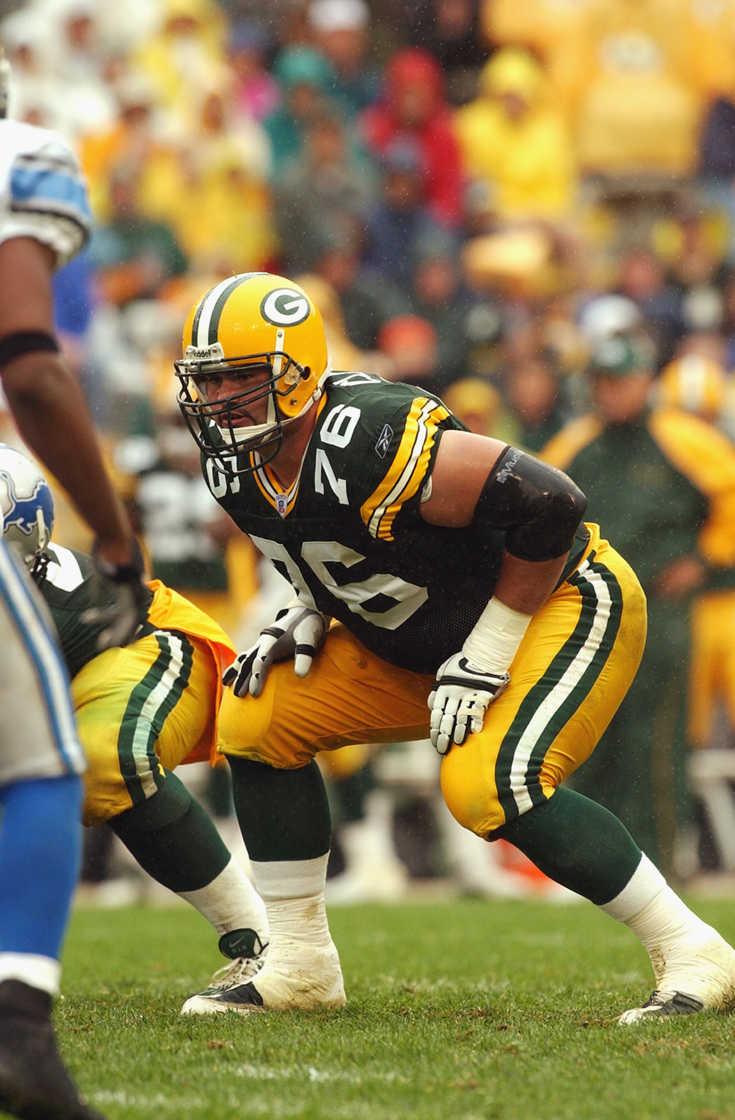 GREEN BAY, WI - SEPTEMBER 14:  Tackle Chad Clifton #76 of the Green Bay Packers waits for the snap during the game against the Detroit Lions at Lambeau Field on September 14, 2003 in Green Bay, Wisconsin. The Packers defeated the Lions 31-6. (Photo by Jon