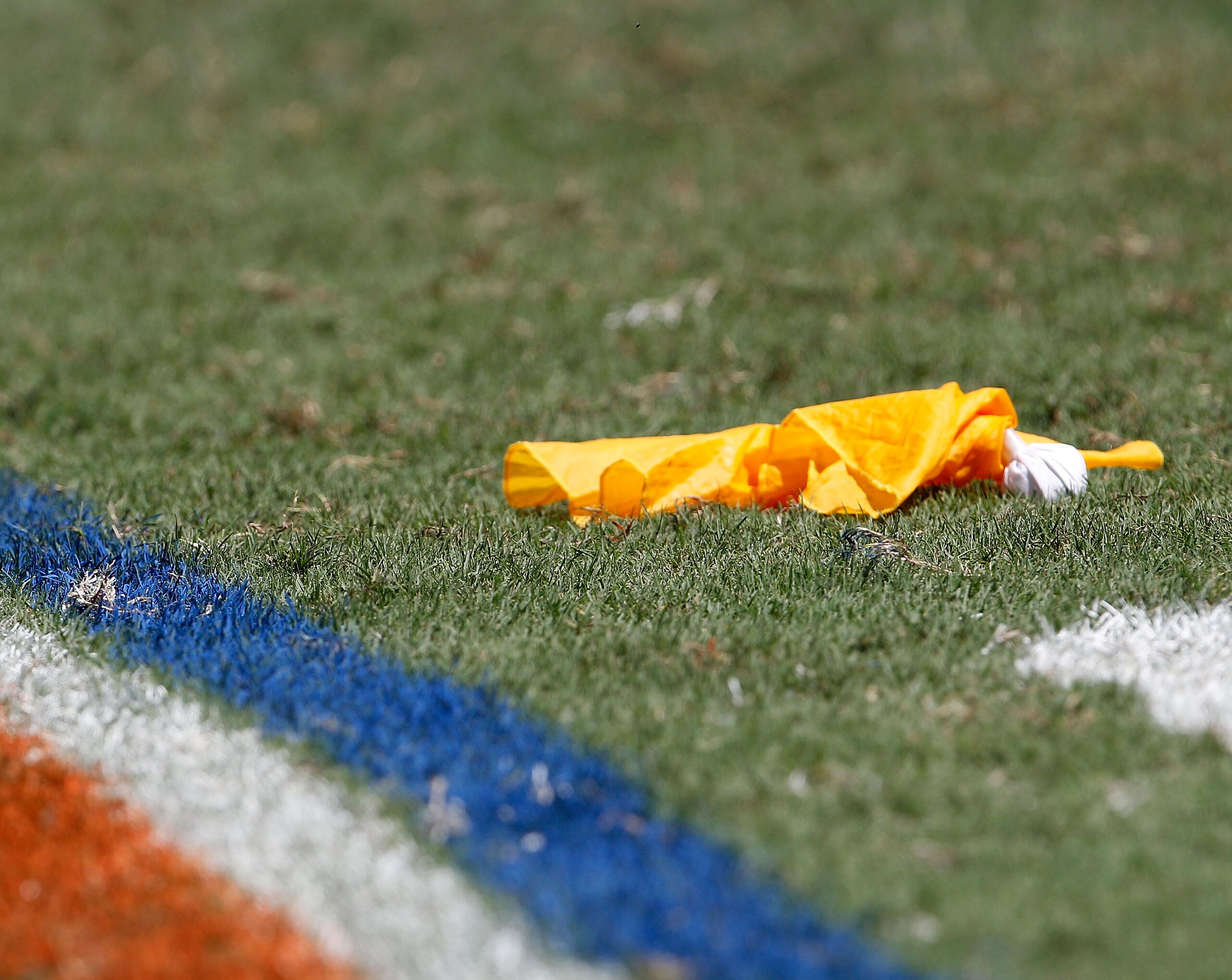 GAINESVILLE, FL - SEPTEMBER 11:  A penalty flag lies on the field during a game between the South Florida Bulls and the Florida Gators at Ben Hill Griffin Stadium on September 11, 2010 in Gainesville, Florida.  (Photo by Sam Greenwood/Getty Images)