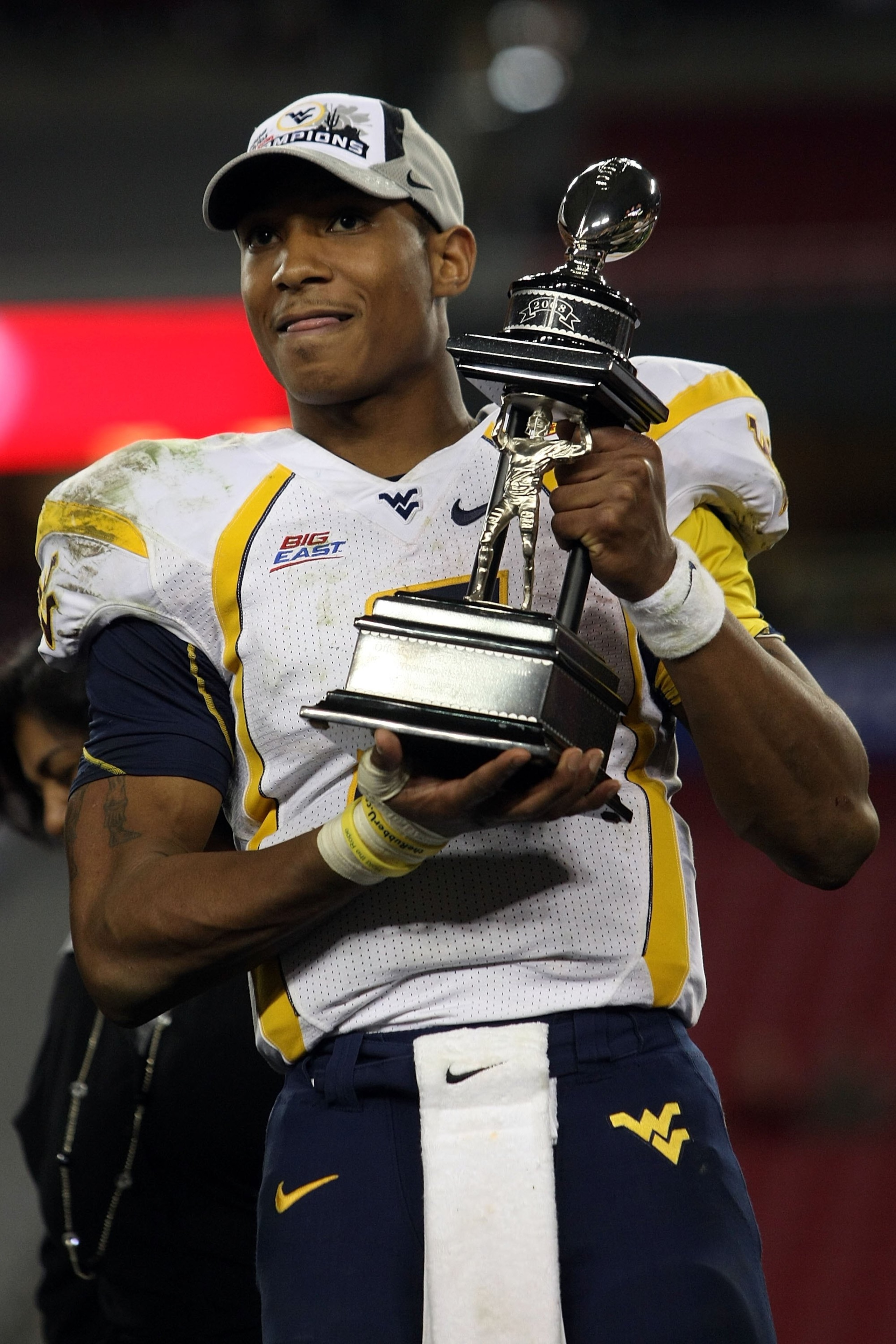 GLENDALE, AZ - JANUARY 02:  Quarterback Patrick White #5 of the West Virginia Mountaineers is given the offensive MVP award after the Mountaineers defeated the Oklahoma Sooners 48-28 after the Tostito's Fiesta Bowl at University of Phoenix Stadium January
