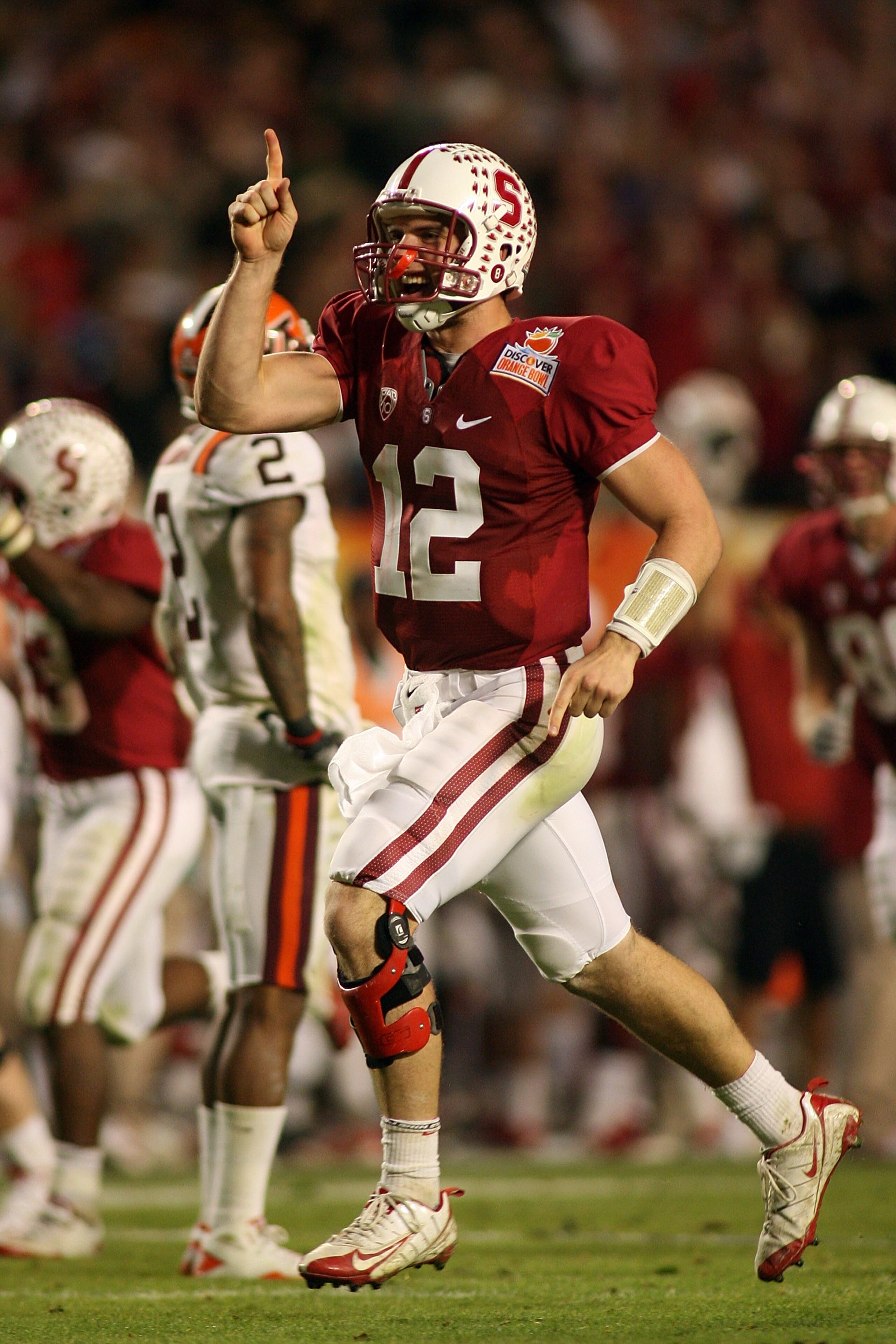 MIAMI, FL - JANUARY 03: Andrew Luck #12 of the Stanford Cardinal celebrates after he threw a 41-yard touchdown pass to Colby Fleener #82 in the third quarterback against the Virginia Tech Hokies during the 2011 Discover Orange Bowl at Sun Life Stadium on