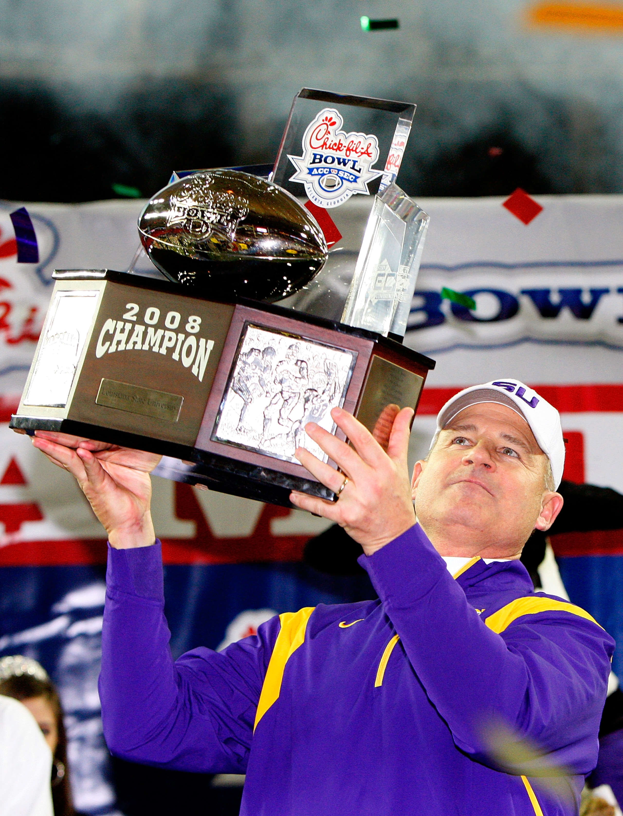 ATLANTA - DECEMBER 31: Head coach Les Miles of the LSU Tigers lifts up the trophy after a 38-3 win over the Georgia Tech Yellow Jackets in the Chick-fil-A Bowl on December 31, 2008 at the Georgia Dome in Atlanta, Georgia. (Photo by Kevin C. Cox/Getty Im ATLANTA - DECEMBER 31: Head coach Les Miles of the LSU Tigers lifts up the trophy after a 38-3 win over the Georgia Tech Yellow Jackets in the Chick-fil-A Bowl on December 31, 2008 at the Georgia Dome in Atlanta, Georgia. (Photo by Kevin C. Cox/Getty Im