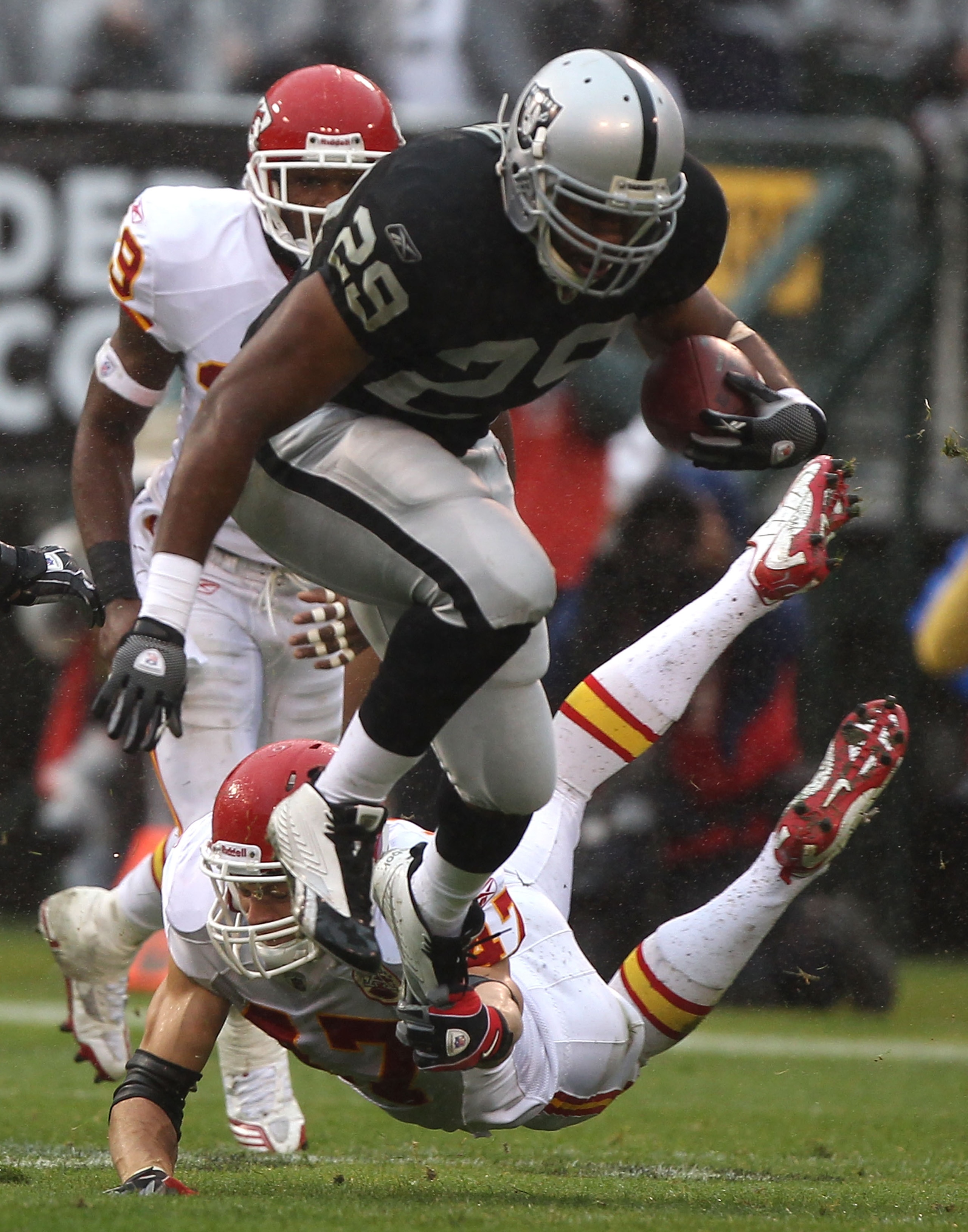 OAKLAND, CA - NOVEMBER 07:  Michael Bush #29 of the Oakland Raiders runs against Jon McGraw  #47 of the Kansas City Chiefs during an NFL game at Oakland-Alameda County Coliseum on November 7, 2010 in Oakland, California.  (Photo by Jed Jacobsohn/Getty Ima