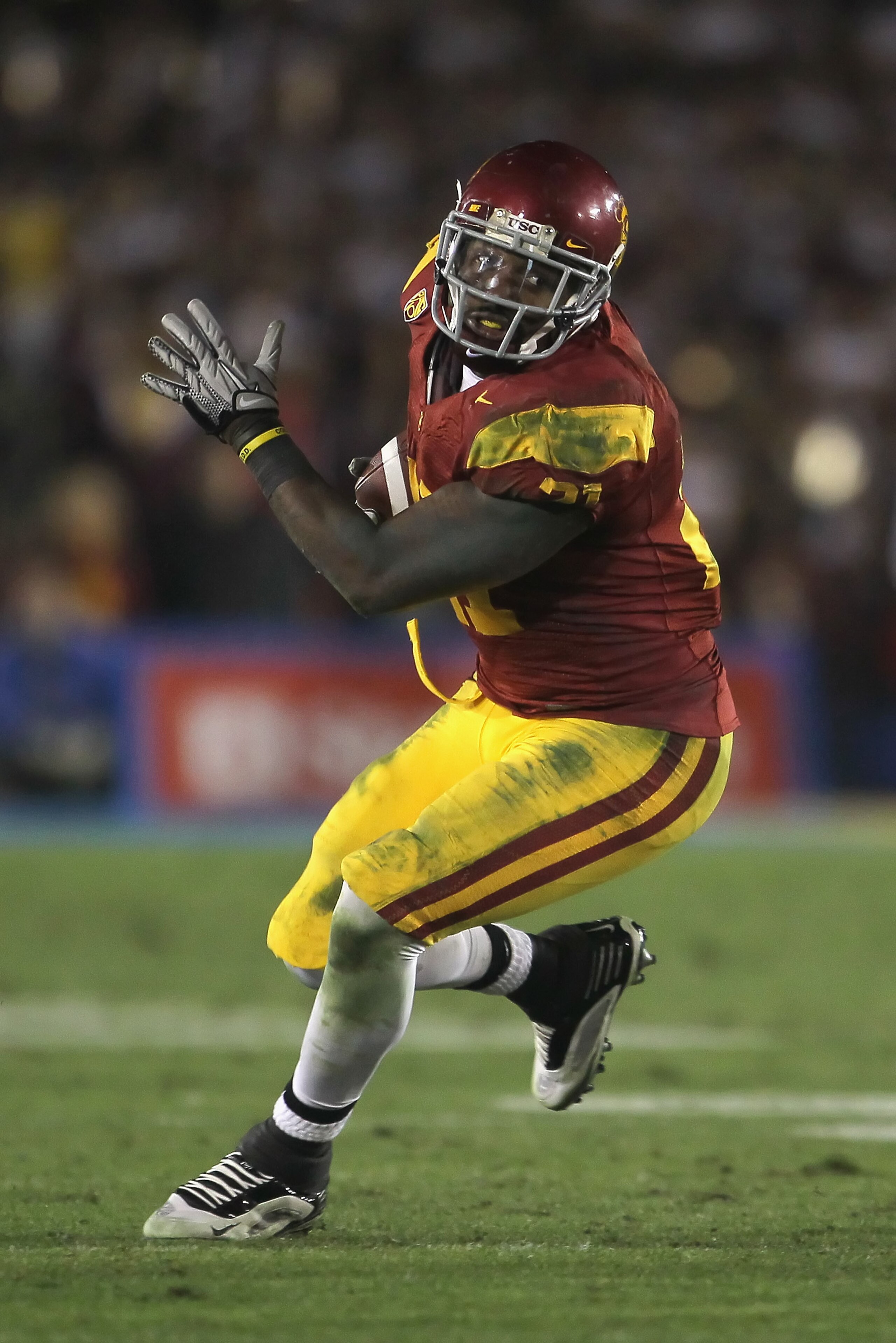 PASADENA, CA - DECEMBER 04:  Running back Allen Bradford #21 of the USC Trojans carries the ball against the UCLA Bruins during the second half at the Rose Bowl on December 4, 2010 in Pasadena, California. USC defeated UCLA 28-14.  (Photo by Jeff Gross/Ge