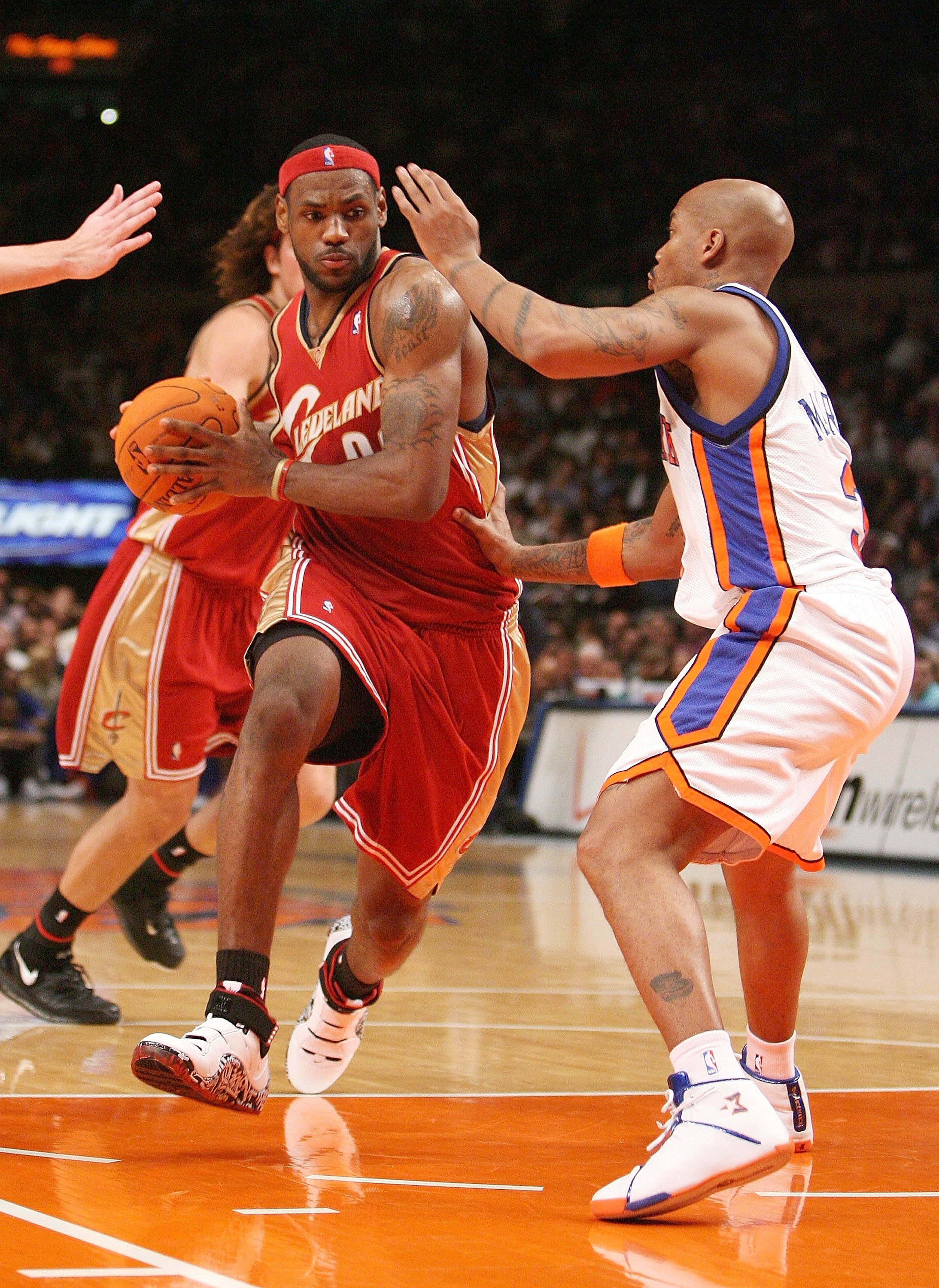 NEW YORK - NOVEMBER 13:  LeBron James #23 of the Cleveland Cavaliers charges past Stephon Marbury #3 of the New York Knicks on November 13, 2006 at Madison Square Garden in New York City.  NOTE TO USER: User expressly acknowledges and agrees that, by down