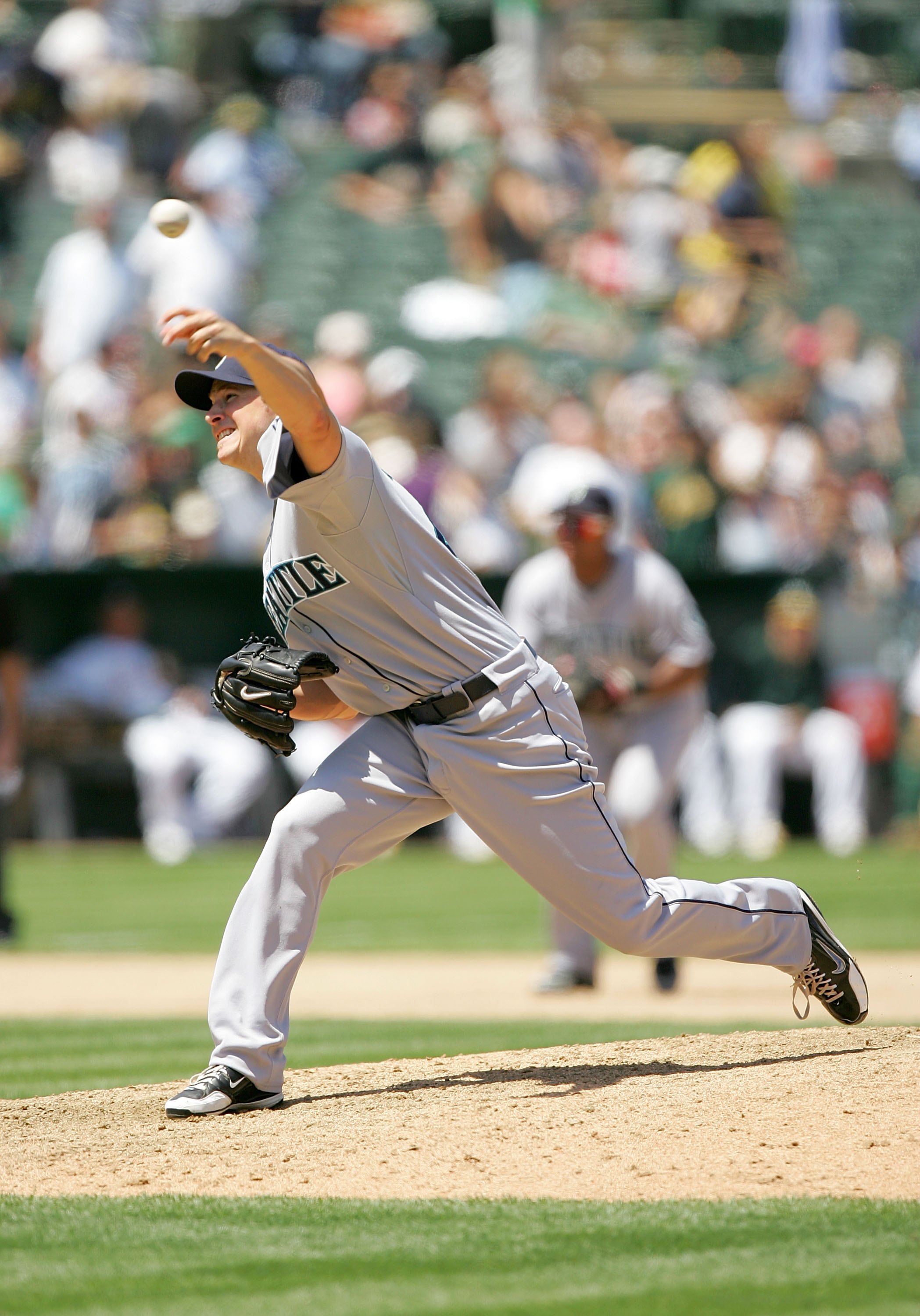 Former Oakland Athletics pitcher Dallas Braden wears a jersey of former San  Francisco Giants pitcher Tim Lincecum before a baseball game between the  Athletics and the Giants in Oakland, Calif., Friday, Aug.