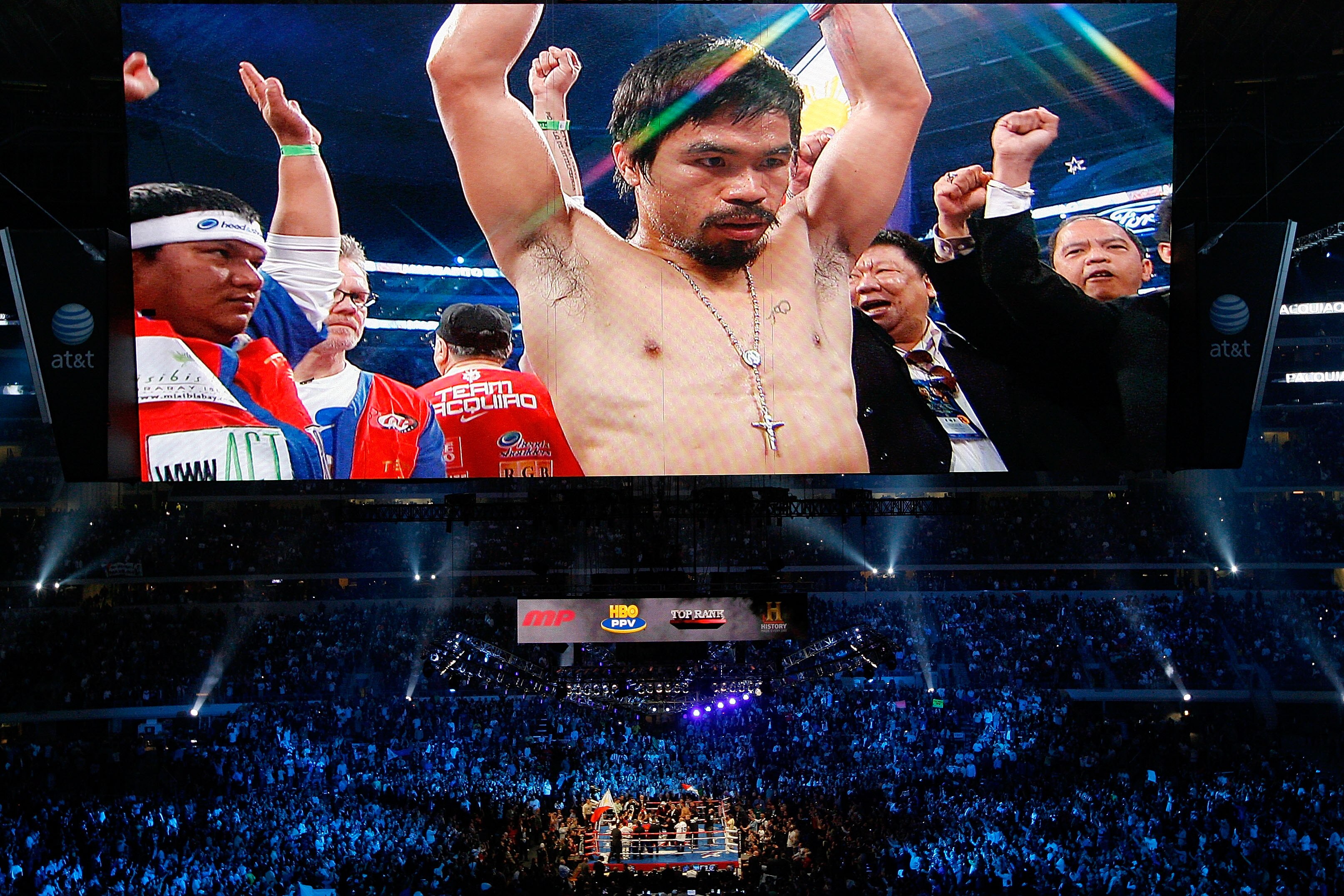 ARLINGTON, TX - NOVEMBER 13:  The likeness Manny Pacquiao (white trunks) of the Philippines is seen on the giant screen as he is introduced prior to fighting against Antonio Margarito (black trunks) of Mexico during their WBC World Super Welterweight Titl