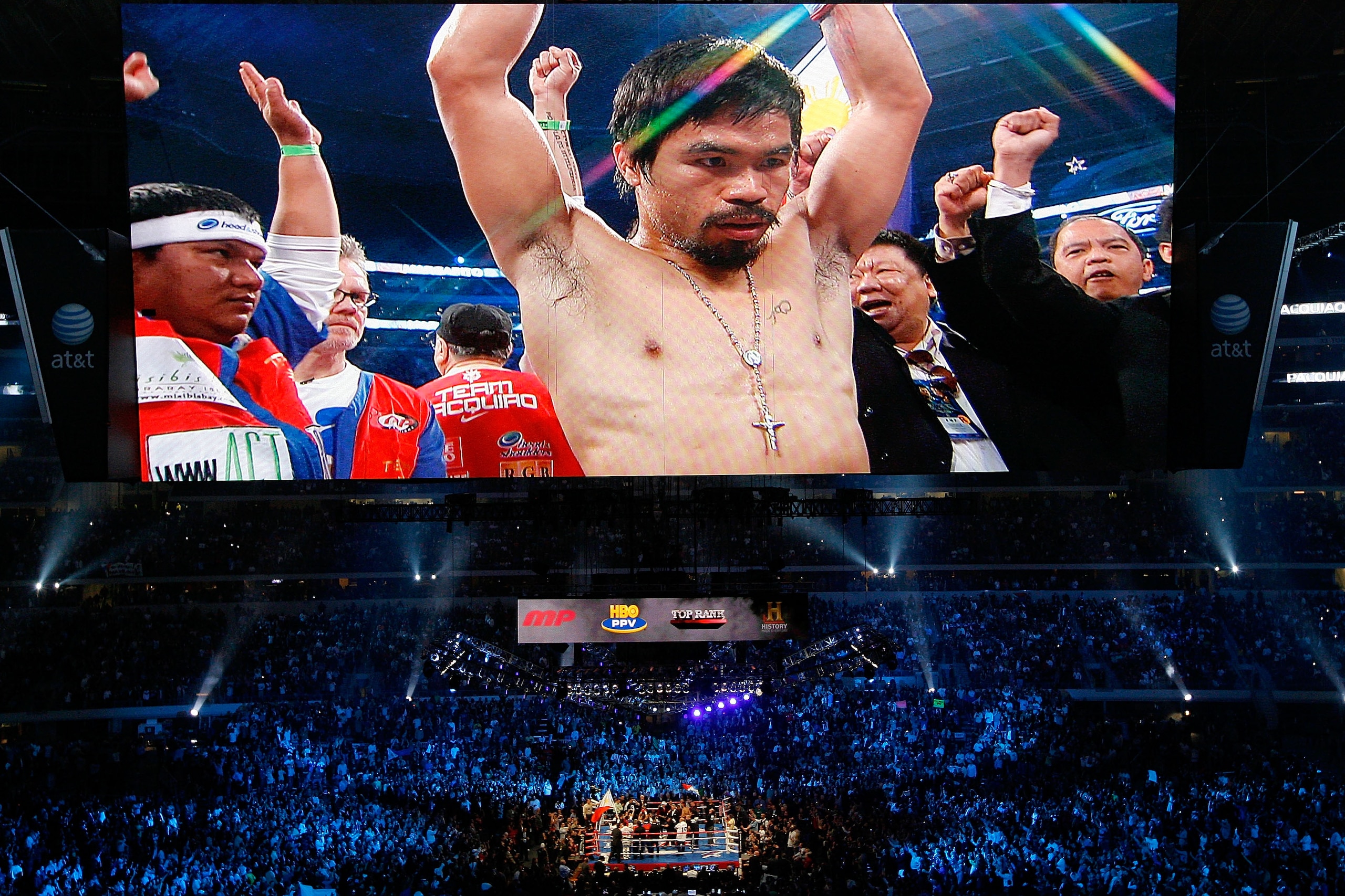 ARLINGTON, TX - NOVEMBER 13:  The likeness Manny Pacquiao (white trunks) of the Philippines is seen on the giant screen as he is introduced prior to fighting against Antonio Margarito (black trunks) of Mexico during their WBC World Super Welterweight Titl