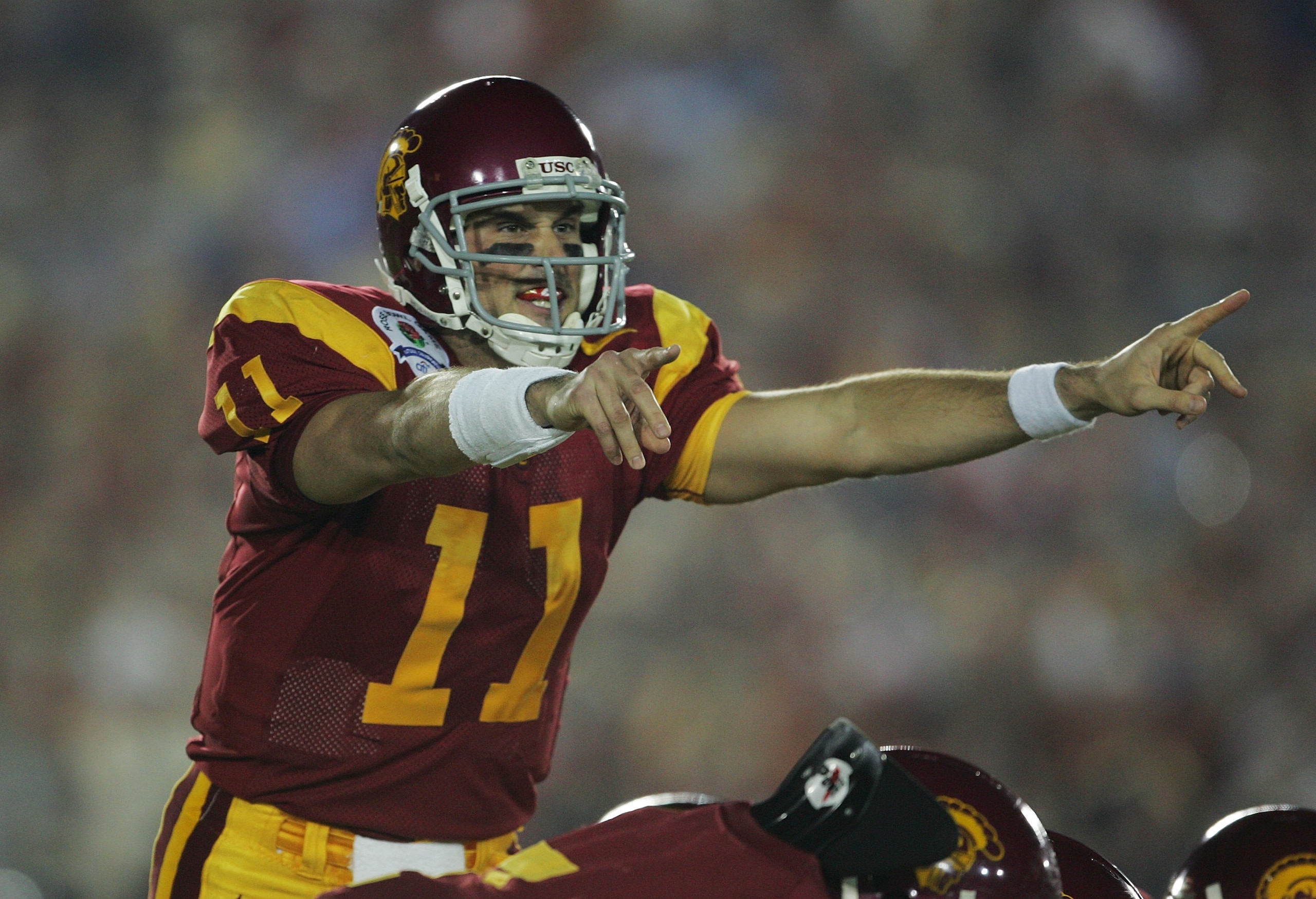PASADENA, CA - JANUARY 04:  Quarterback Matt Leinart #11 of the USC Trojans call a play in the first quarter against the Texas Longhorns during the BCS National Championship Rose Bowl Game on January 4, 2006 in Pasadena, California.  (Photo by Stephen Dun