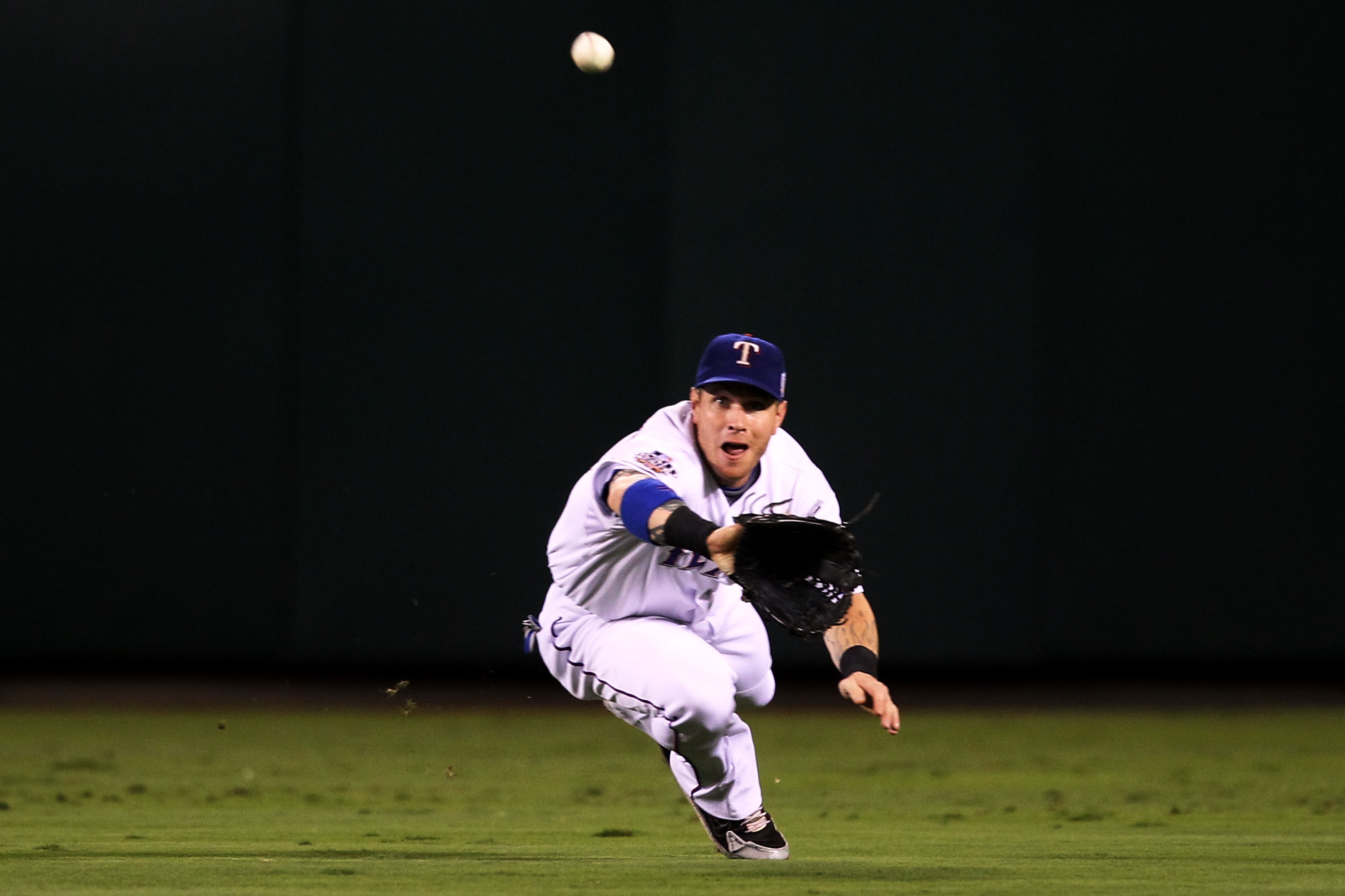 ARLINGTON, TX - OCTOBER 31:  Josh Hamilton #32 of the Texas Rangers makes a diving catch in the second inning against the San Francisco Giants in Game Four of the 2010 MLB World Series at Rangers Ballpark in Arlington on October 31, 2010 in Arlington, Tex