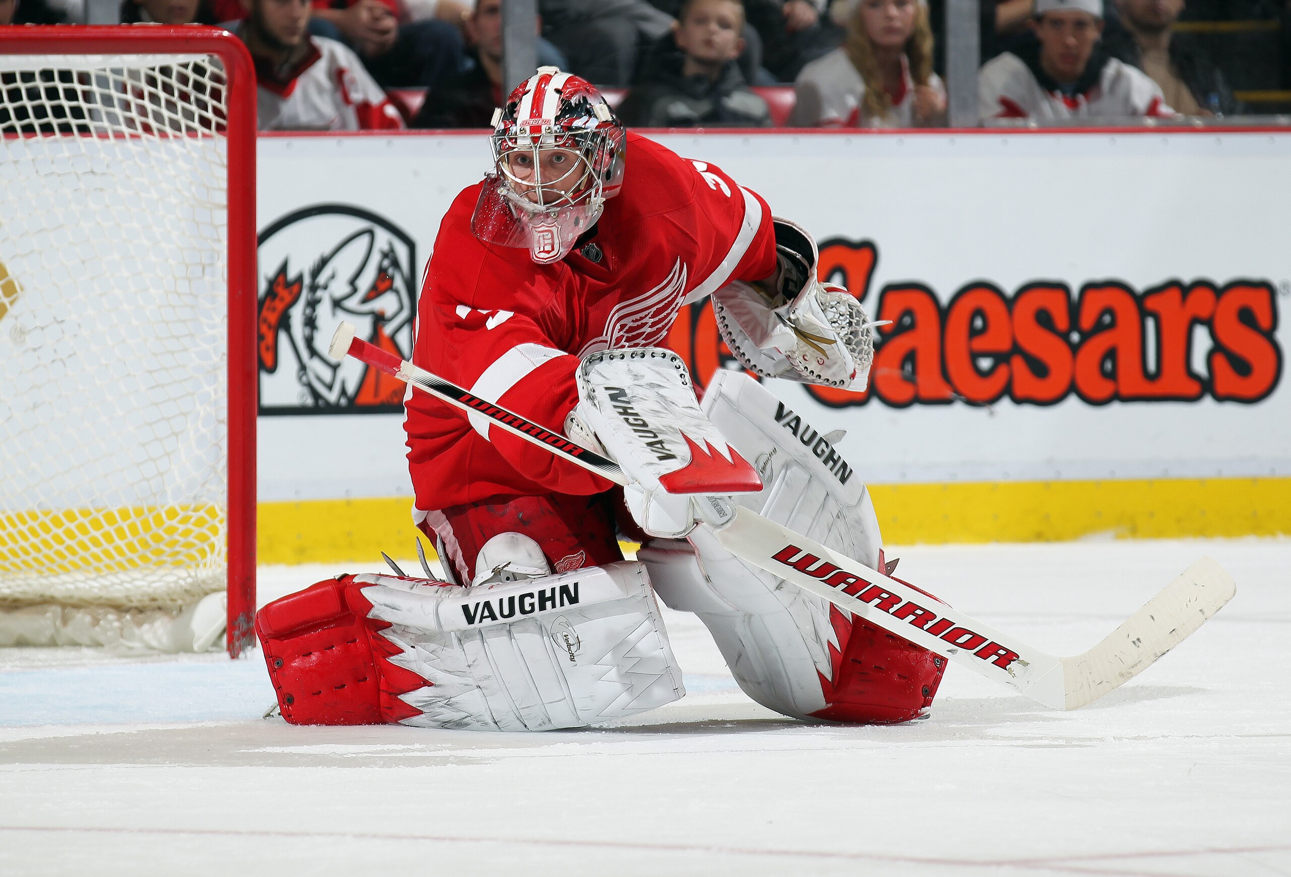 DETROIT, MI - DECEMBER 22:  Jimmy Howard #35 of the Detroit Red Wings scrambles to get back in position in a game against the Vancouver Canucks on December 22, 2010 at the Joe Louis Arena in Detroit, Michigan. The Wings defeated the Canucks 5-4 in overtim