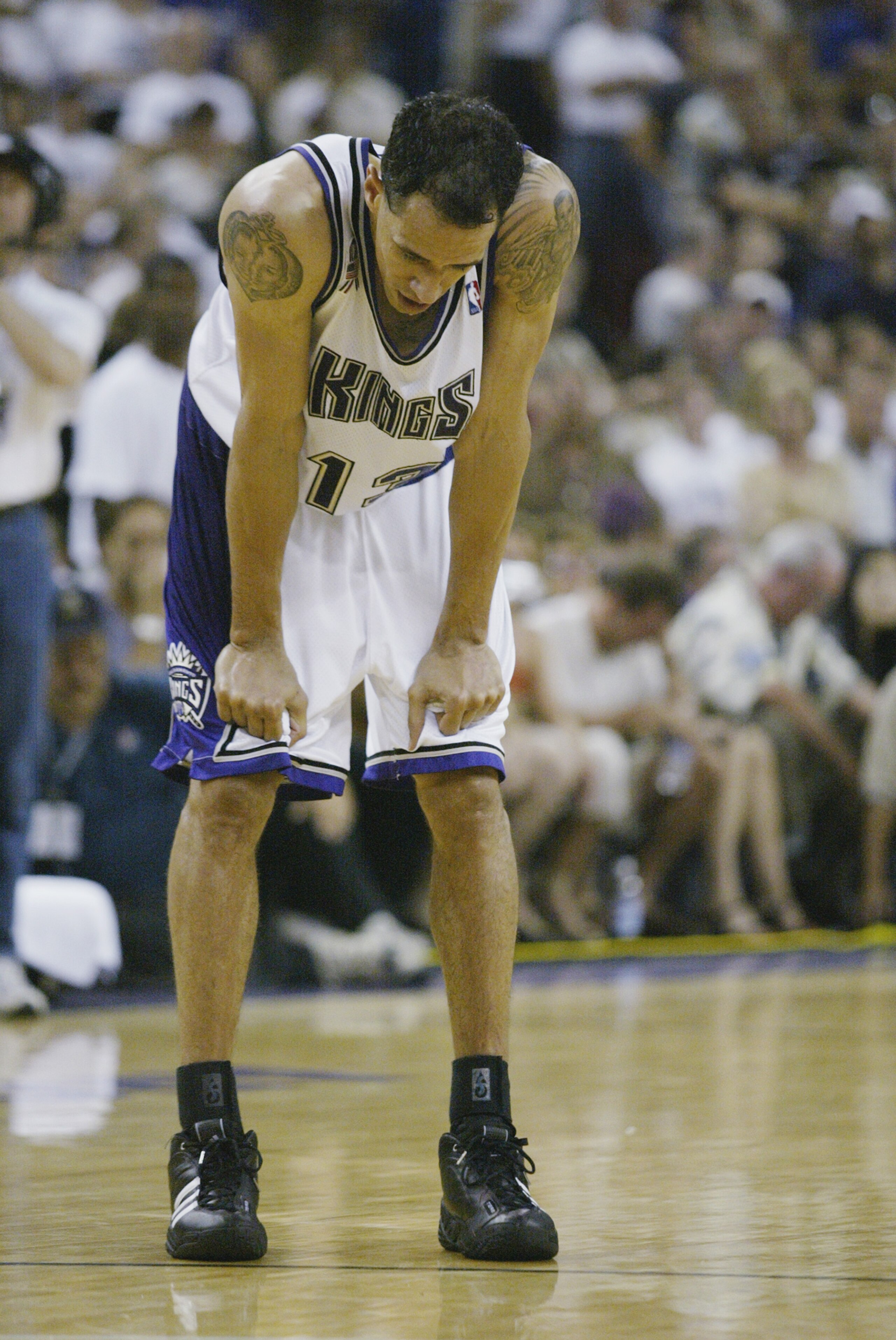 SACRAMENTO, CA - JUNE 2: Doug Christie #13 of the Sacramento Kings pauses in Game seven of the Western Conference Finals against the Los Angeles Lakers during the 2002 NBA Playoffs at Arco Arena in Sacramento, California on June 2, 2002. The Lakers won SACRAMENTO, CA - JUNE 2: Doug Christie #13 of the Sacramento Kings pauses in Game seven of the Western Conference Finals against the Los Angeles Lakers during the 2002 NBA Playoffs at Arco Arena in Sacramento, California on June 2, 2002. The Lakers won
