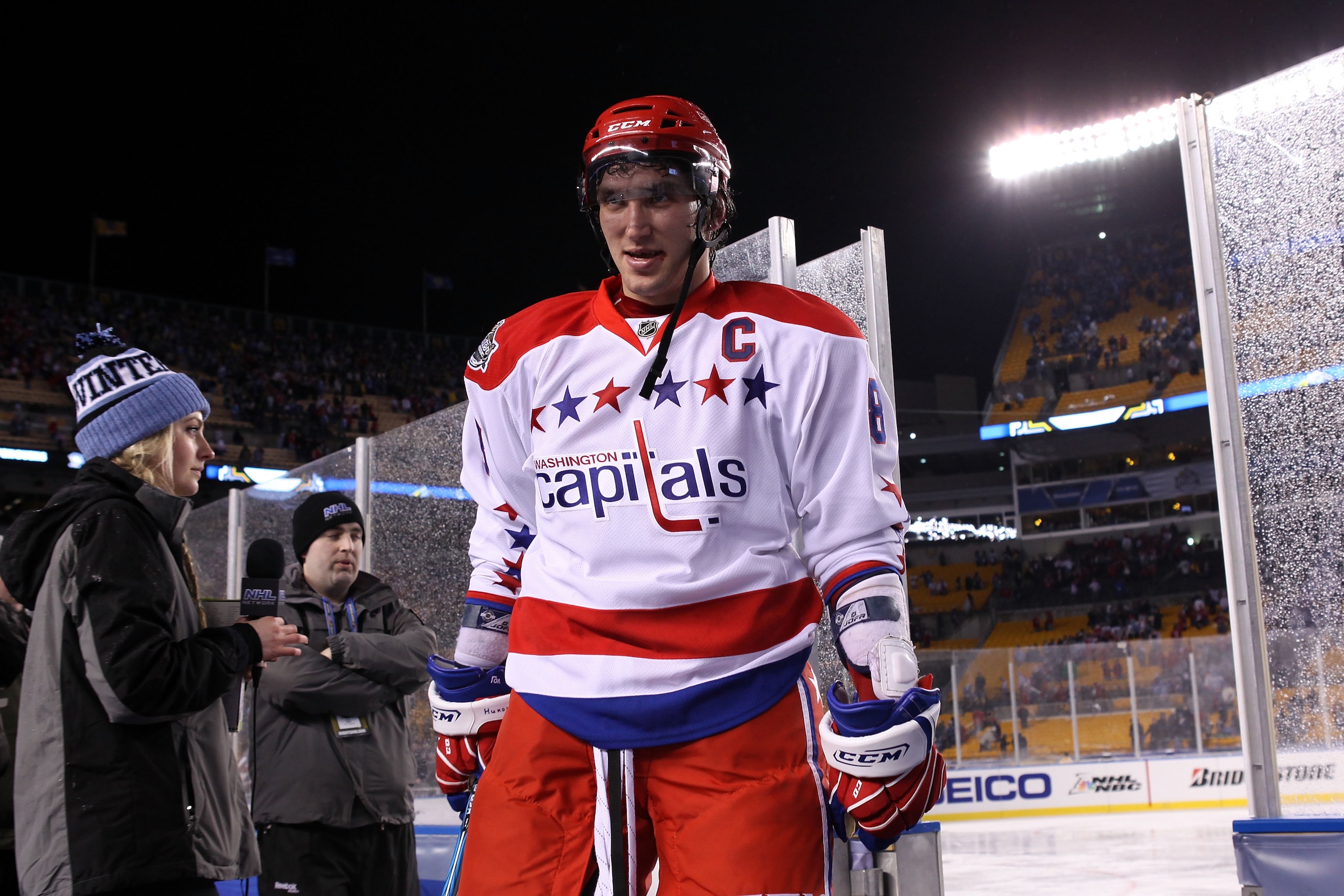 PITTSBURGH, PA - JANUARY 01:  Alex Ovechkin #8 of the Washington Capitals walks off the ice after defeating the Pittsburgh Penguins 3-1 during the 2011 NHL Bridgestone Winter Classic at Heinz Field on January 1, 2011 in Pittsburgh, Pennsylvania.  (Photo b