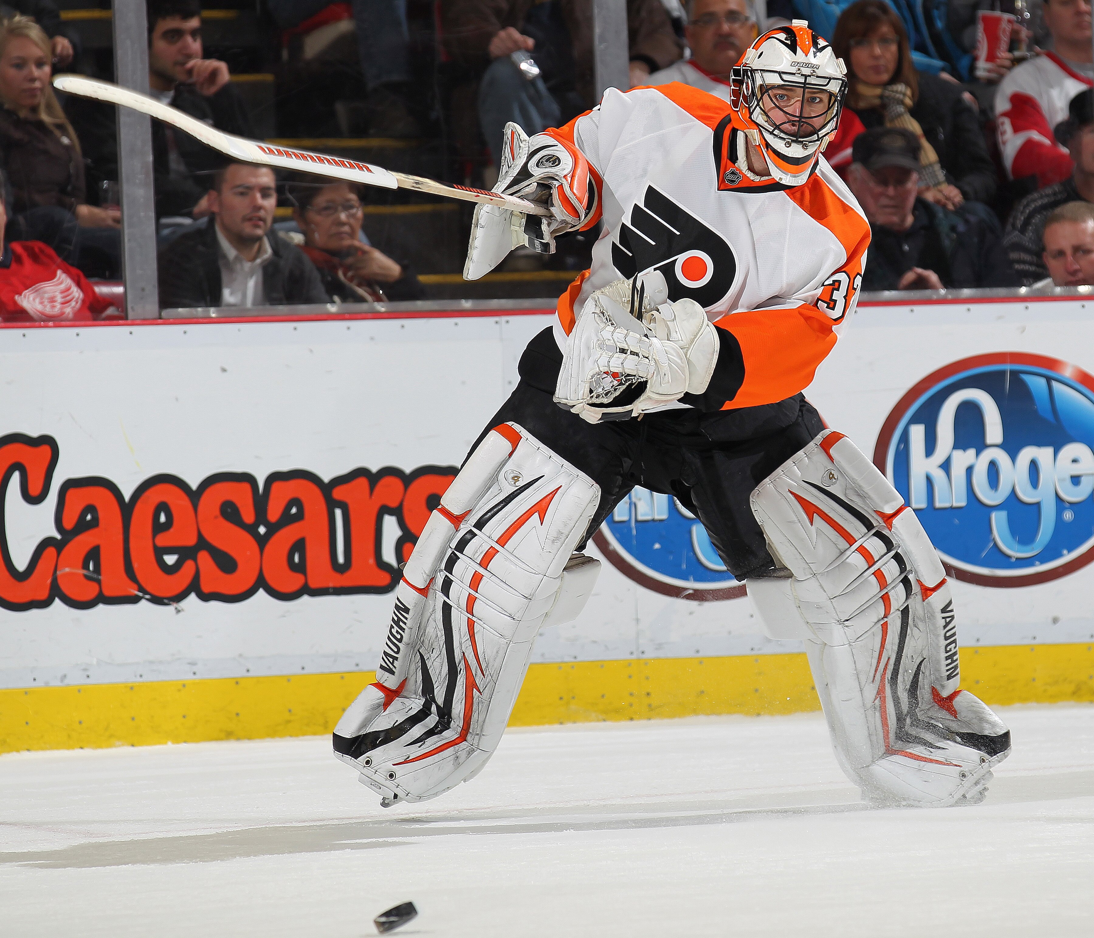 DETROIT, MI - JANUARY 2:  Brian Boucher #33 of the Philadelphia Flyers clears the puck out of harms way in a game against the Detroit Red Wings on January 2, 2011 at the Joe Louis Arena in Detroit, Michigan. The Flyers defeated the Wings 3-2. (Photo by Cl