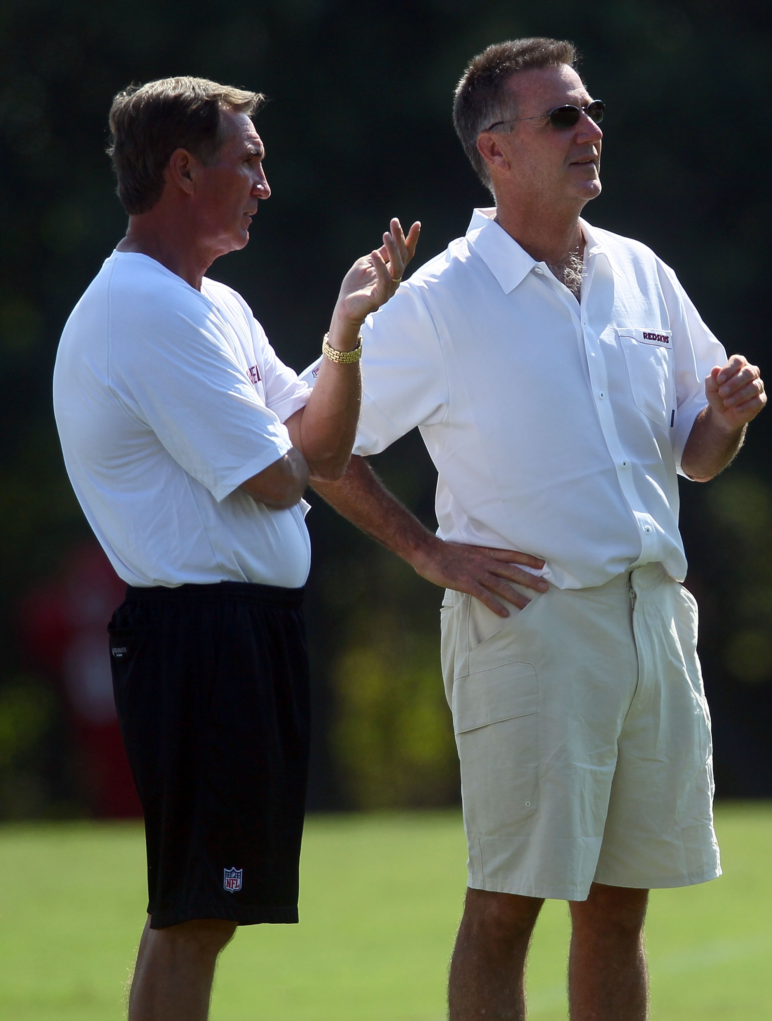 ASHBURN, VA - JULY 30: Head coach Mike Shanahan (L) of the Washington Redskins speaks with general manager Bruce Allen during the second day of training camp July 30, 2010 in Ashburn, Virginia. (Photo by Win McNamee/Getty Images) ASHBURN, VA - JULY 30: Head coach Mike Shanahan (L) of the Washington Redskins speaks with general manager Bruce Allen during the second day of training camp July 30, 2010 in Ashburn, Virginia. (Photo by Win McNamee/Getty Images)