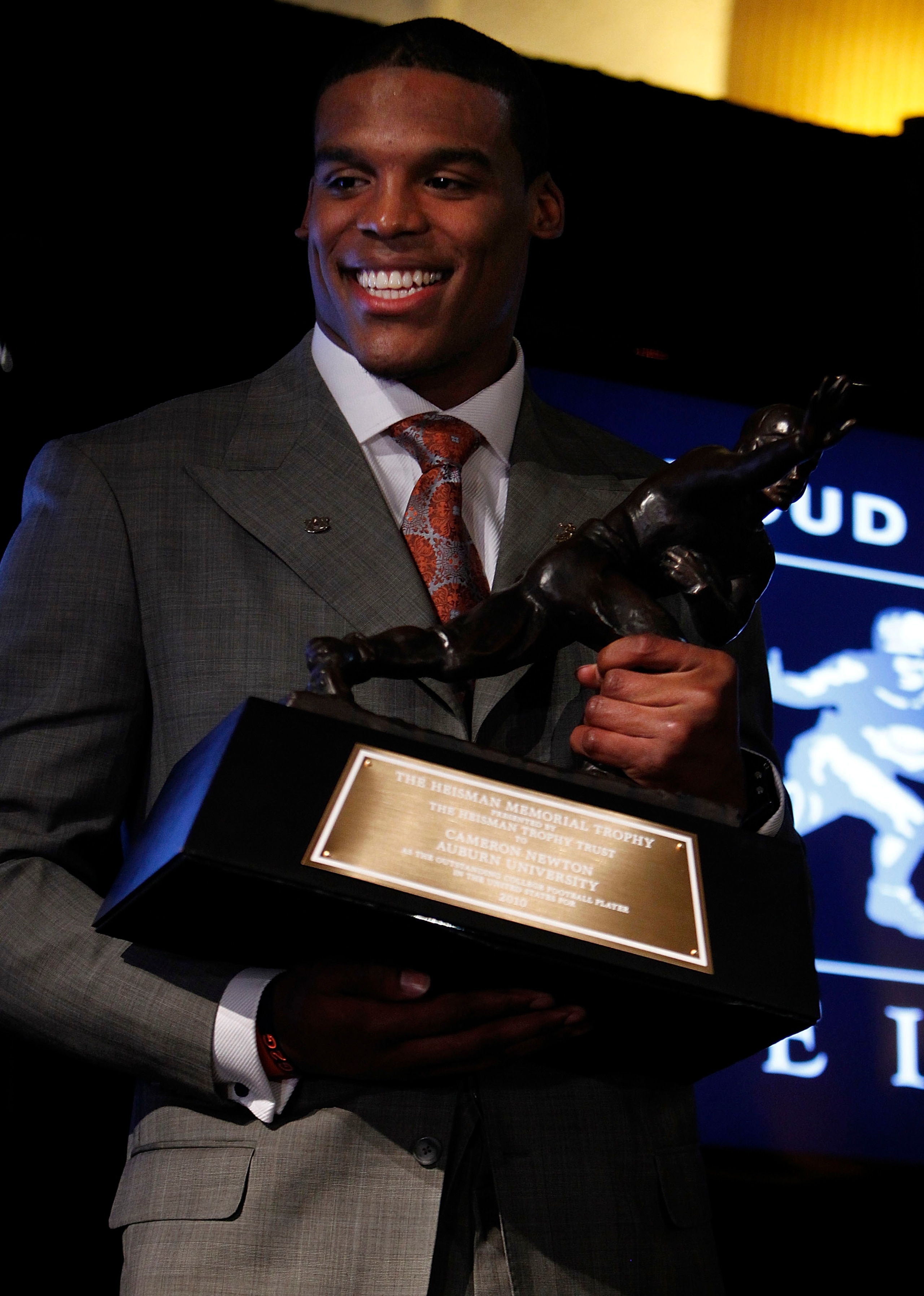 NEW YORK - DECEMBER 11: Cam Newton, quarterback of the Auburn University Tigers, speaks after being awarded the 2010 Heisman Memorial Trophy Award on December 11, 2010 in New York City. (Photo by Jeff Zelevansky/Getty Images) NEW YORK - DECEMBER 11: Cam Newton, quarterback of the Auburn University Tigers, speaks after being awarded the 2010 Heisman Memorial Trophy Award on December 11, 2010 in New York City. (Photo by Jeff Zelevansky/Getty Images)