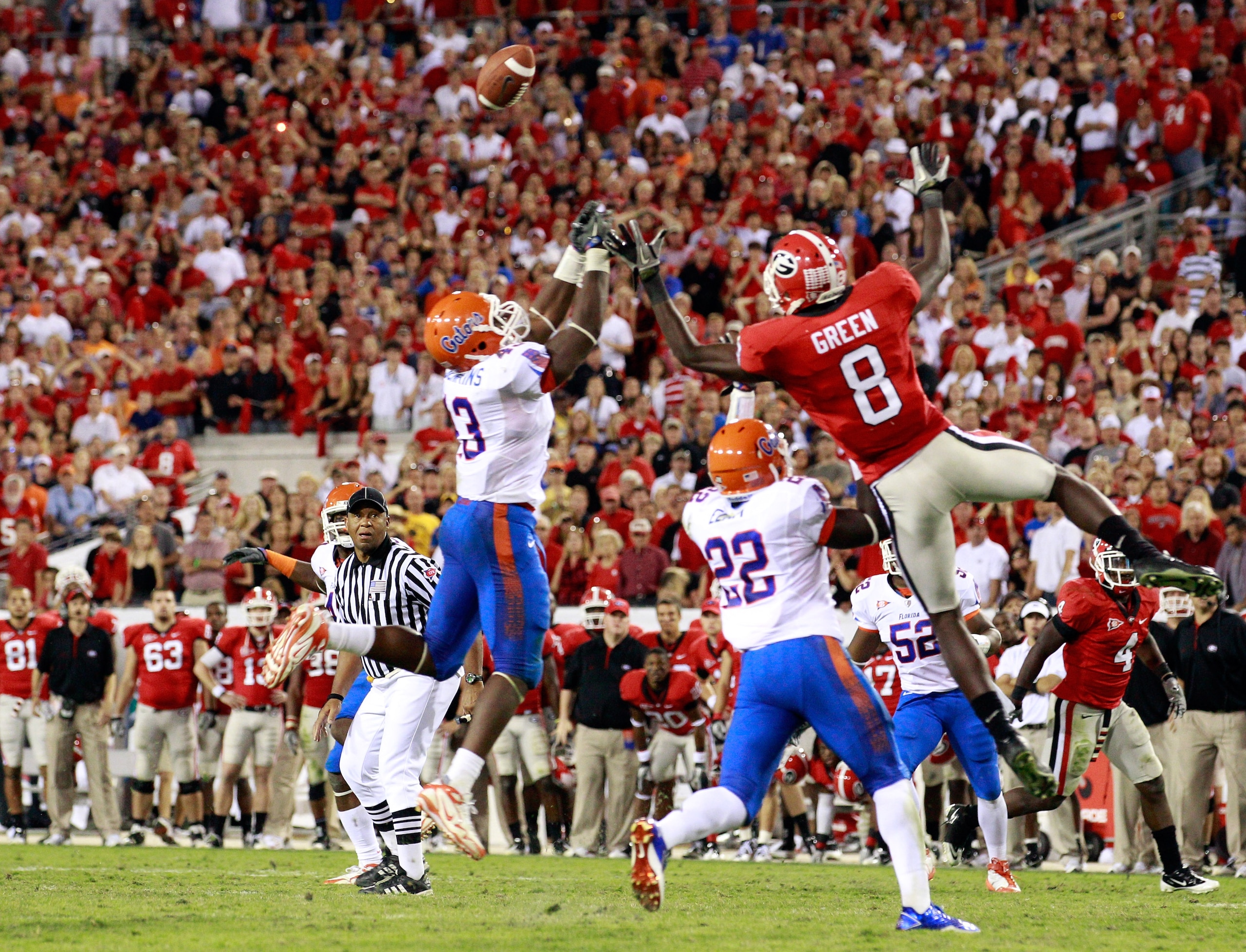JACKSONVILLE, FL - OCTOBER 30:  A.J. Green #8 of the Georgia Bulldogs attempts to catch a pass against Jelani Jenkins #43 and Matt Elam #22 of the Florida Gators during the game at EverBank Field on October 30, 2010 in Jacksonville, Florida.  (Photo by Sa