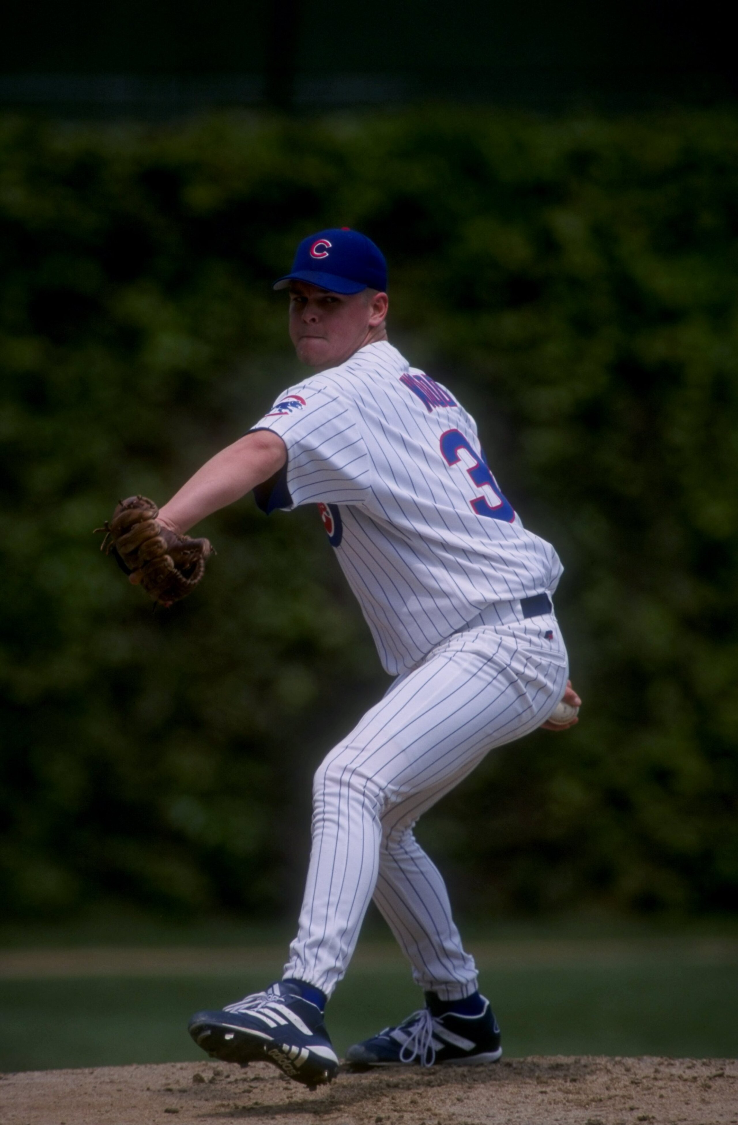 CHICAGO, IL - MAY 6:  Pitcher Kerry Wood #34 of the Chicago Cubs winds up to throw a pitch during the Cubs 2-0 win over the Houston Astros on May 6, 1998 at Wrigley Field in Chicago, Illinois.  Wood pitched a 20 strike out game, tying the league record. (