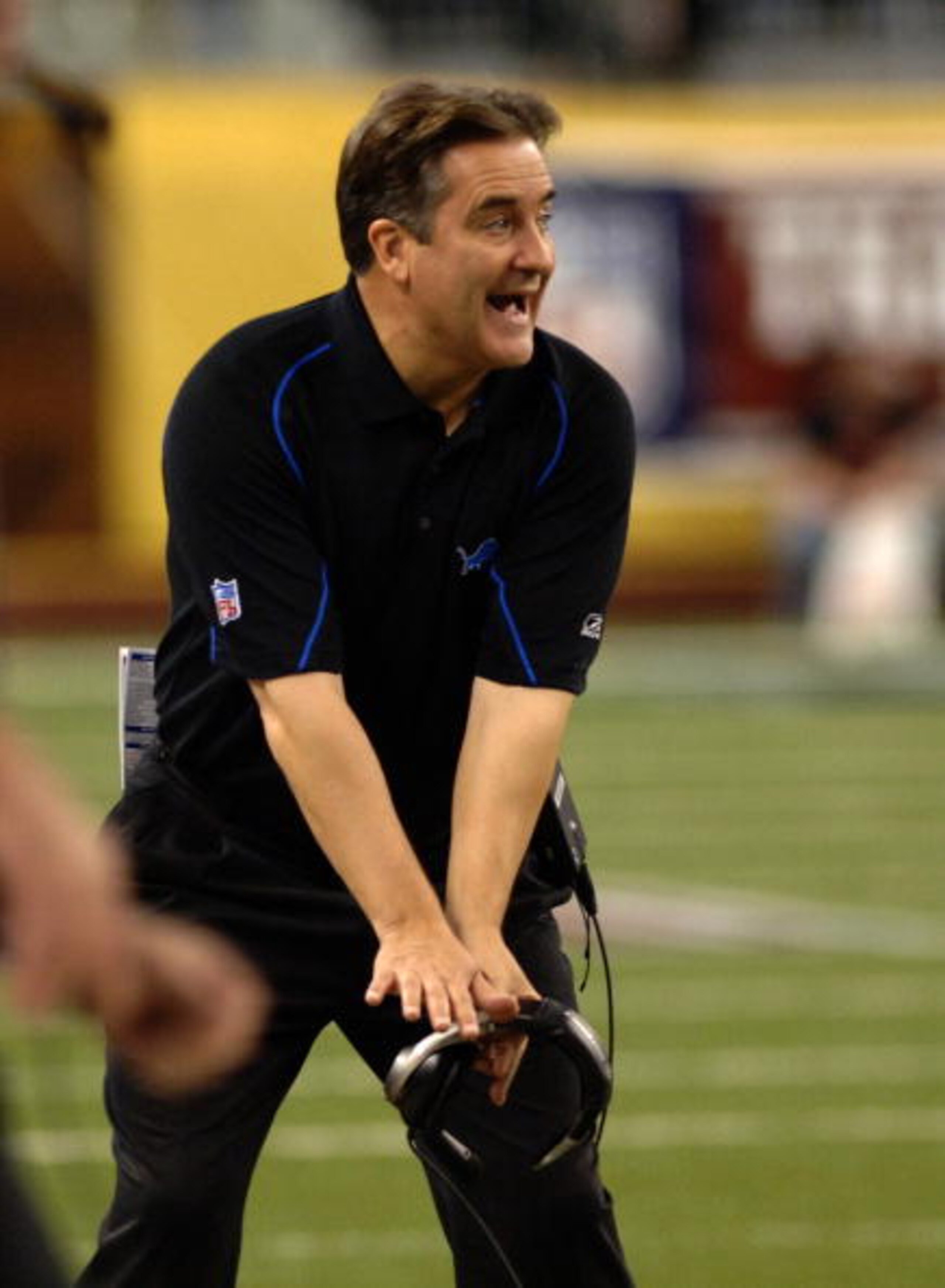 Detroit Lions coach Steve Mariucci calls for a penalty  in a Thanksgiving Day game, November 24, 2005, at Ford Field, Detroit.  The Atlanta Falcons defeated the Lions 27 - 7.  (Photo by Al Messerschmidt/Getty Images)