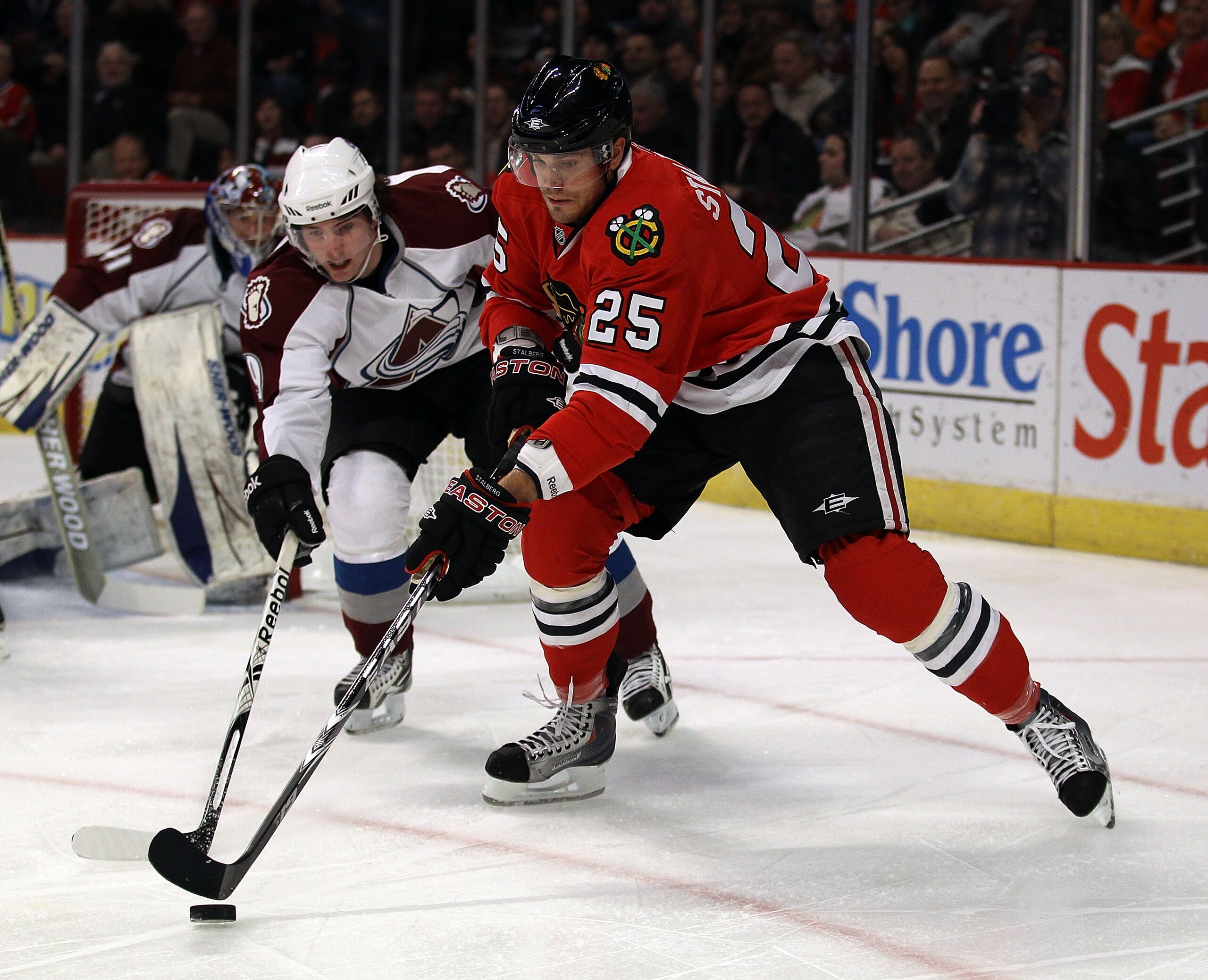 CHICAGO, IL - DECEMBER 15: Viktor Stalberg #25 of the Chicago Blackhawks battles for the puck with Matt Duchene #9 of the Colorado Avalanche at the United Center on December 15, 2010 in Chicago, Illinois. (Photo by Jonathan Daniel/Getty Images)