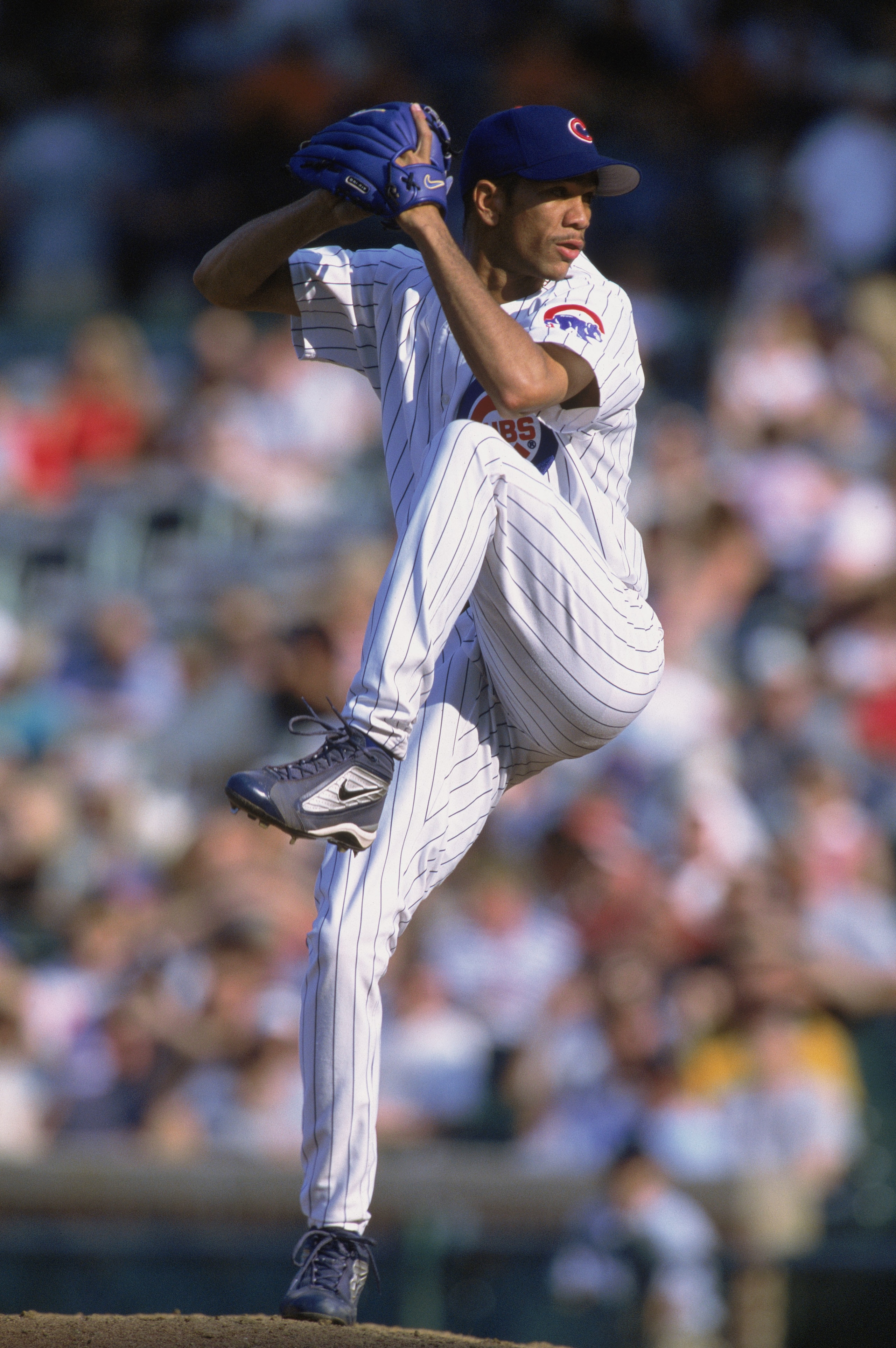 CHICAGO - AUGUST 30:  Juan Cruz #51 of the Chicago Cubs prepares to pitch the ball during their game against the St. Louis Cardinals at Wrigley Field in Chicago, Illinois on August 30th 2002. The Cardinals defeated the Cubs 6-3. (Photo by:  Jonathan Danie