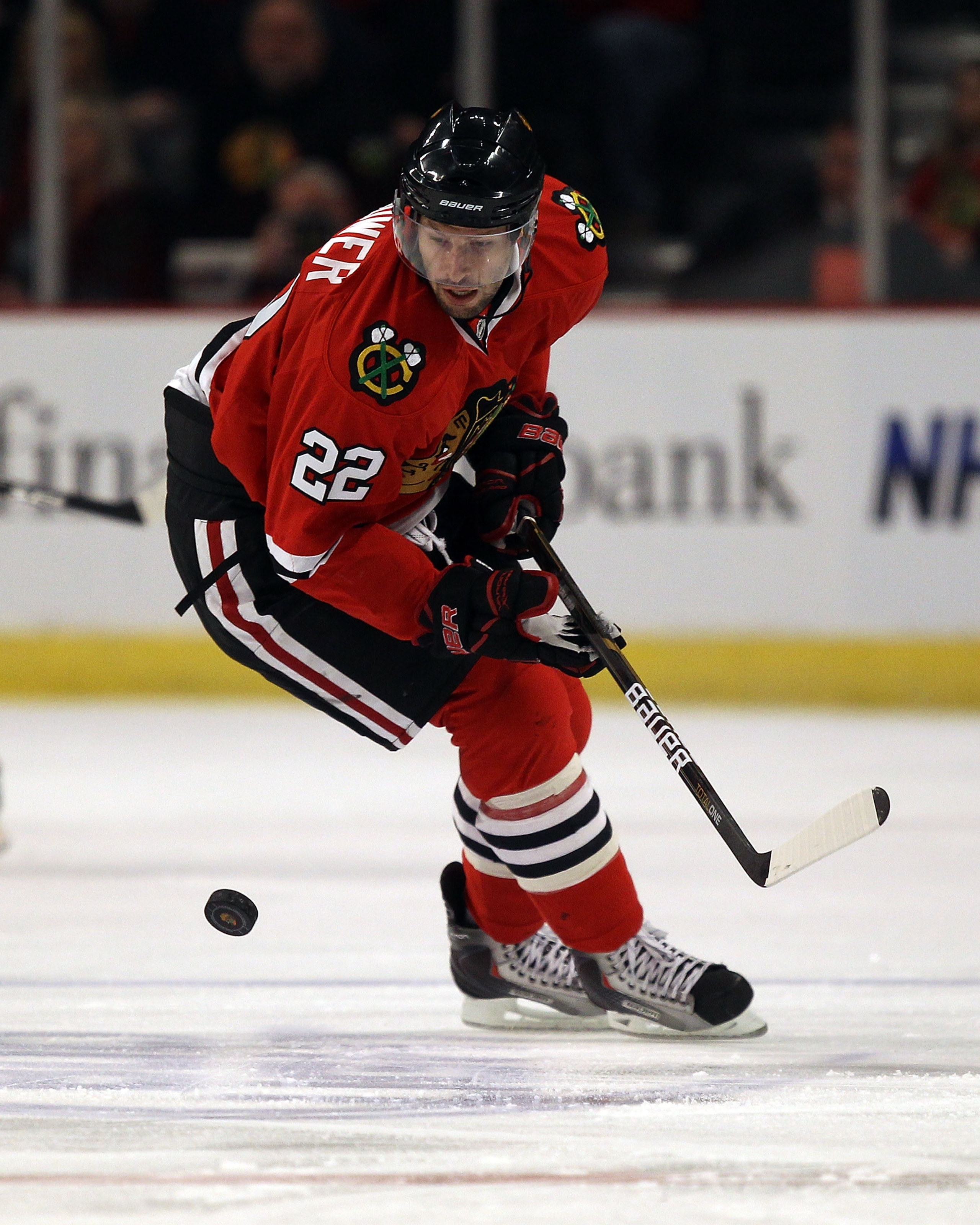 CHICAGO, IL - DECEMBER 19: Troy Brouwer #22 of the Chicago Blackhawks moves to the puck against the Los Angeles Kings at the United Center on December 19, 2010 in Chicago, Illinois. The Blackhawks defeated the Kings 3-2. (Photo by Jonathan Daniel/Getty Im