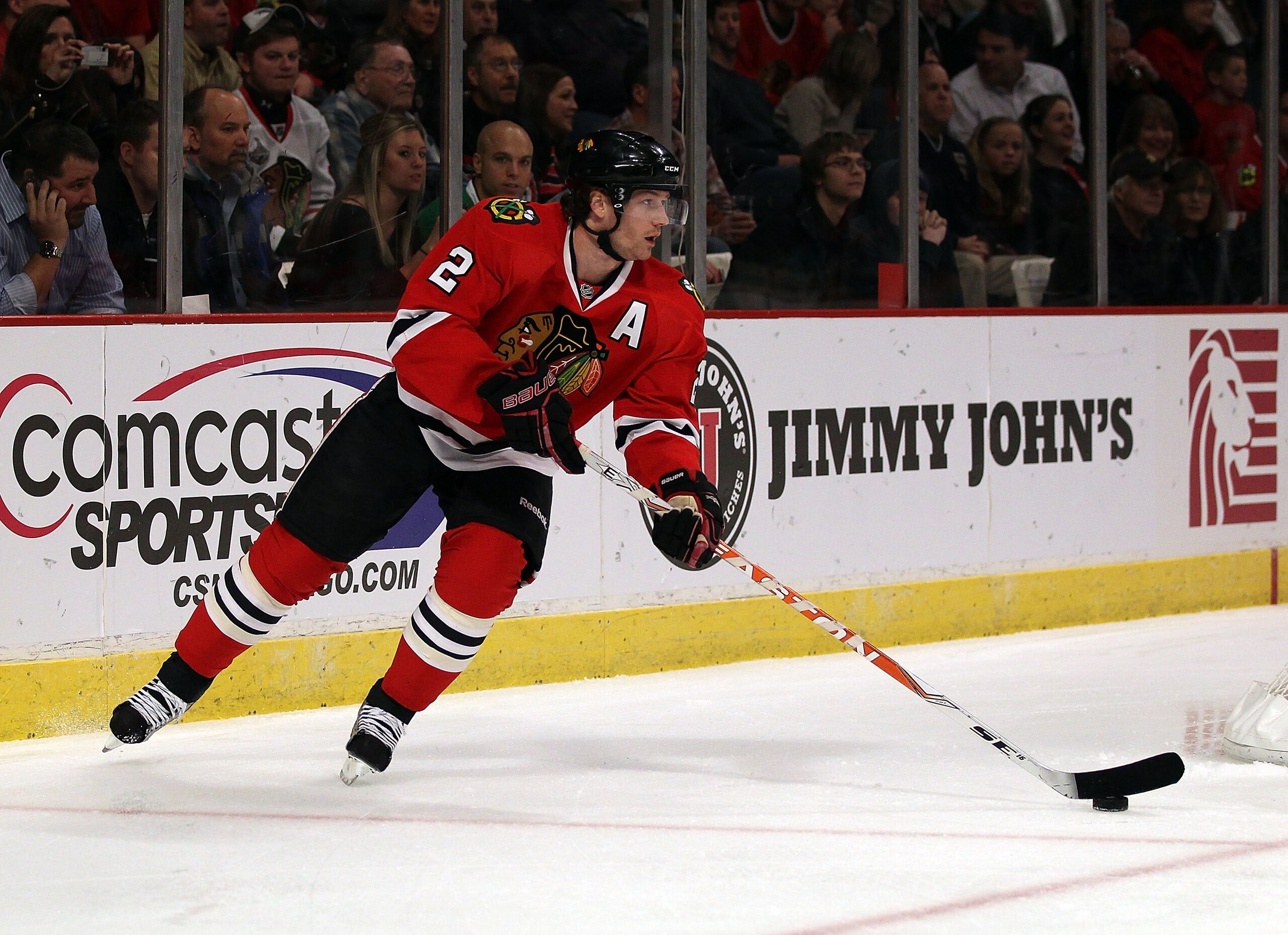 CHICAGO, IL - DECEMBER 03: Duncan Keith #2 of the Chicago Blackhawks controls the puck against the Vancouver Canucks at the United Center on December 3, 2010 in Chicago, Illinois. The Canucks defeated the Blackhawks 3-0. (Photo by Jonathan Daniel/Getty Im
