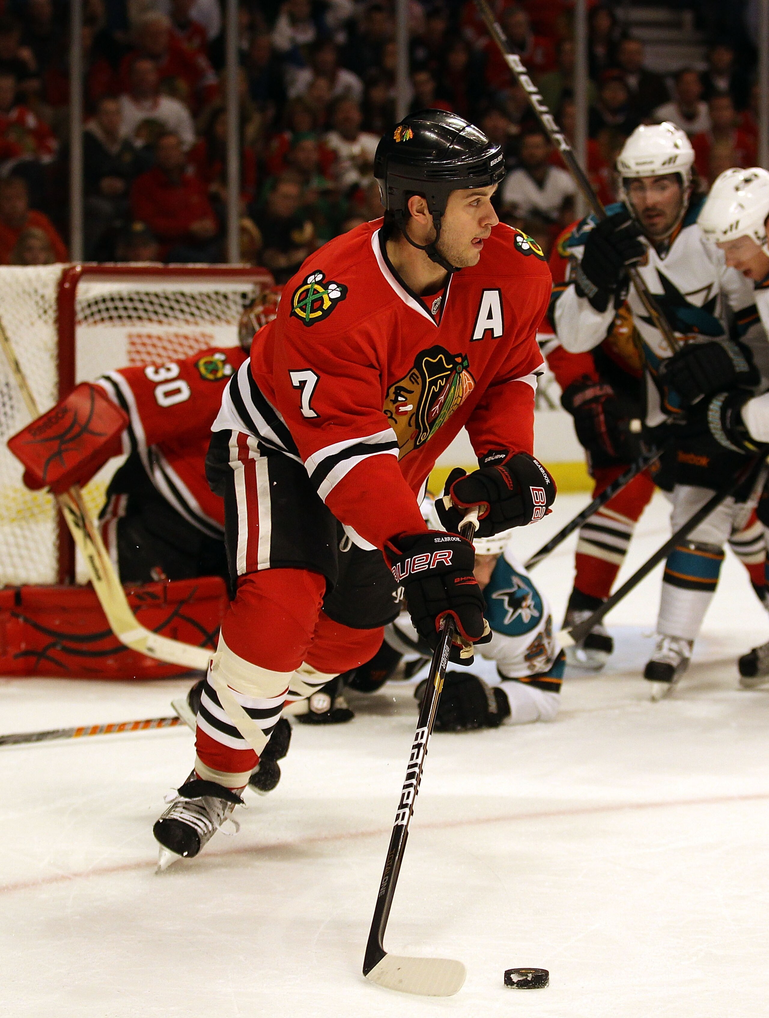CHICAGO, IL - DECEMBER 30: Brent Seabrook #7 of the Chicago Blackhawks looks to pass after clearing  the puck against the San Jose Sharks at the United Center on December 30, 2010 in Chicago, Illinois. The Sharks defeated the Blackhawks 5-3. (Photo by Jon