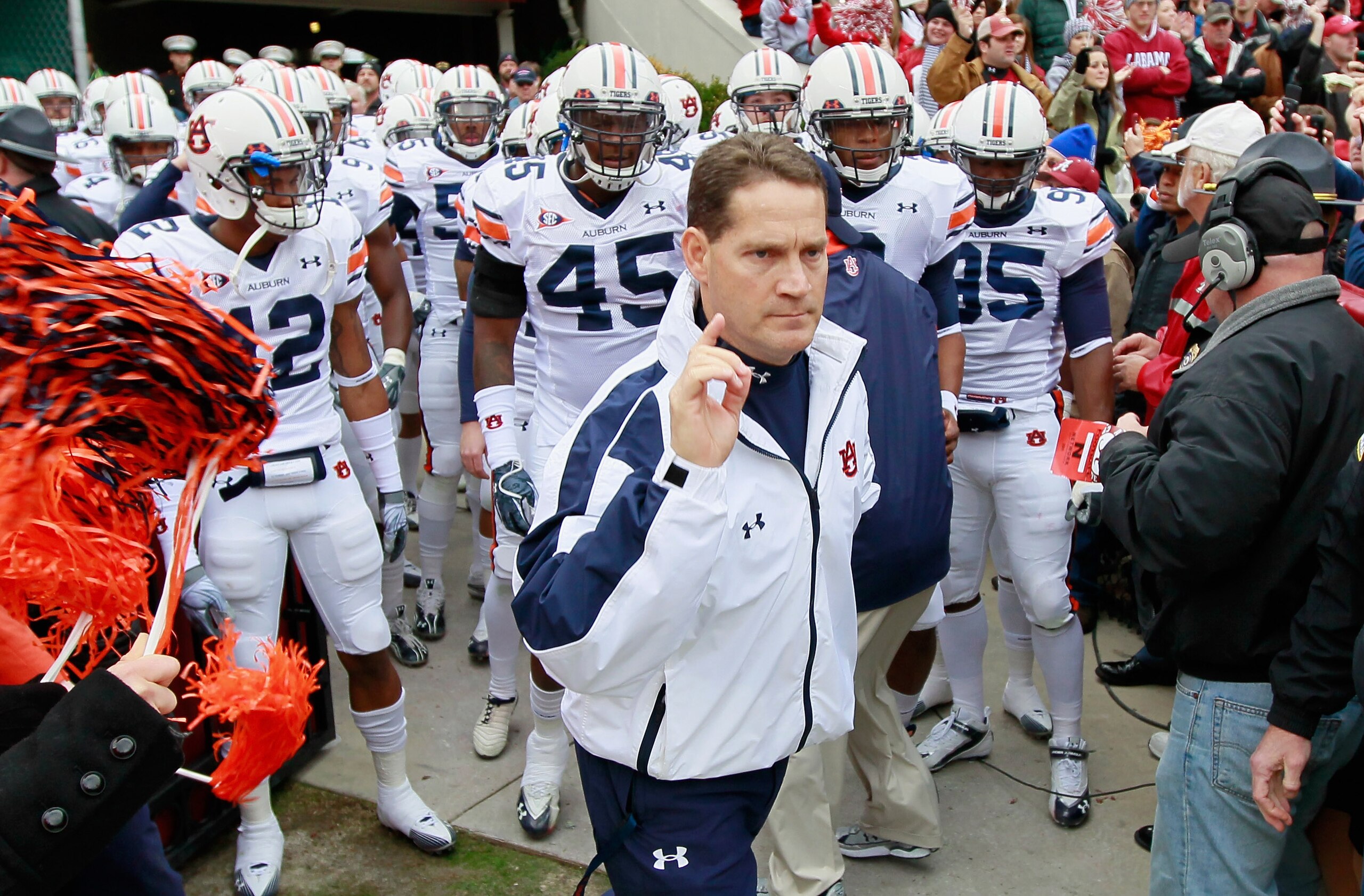 TUSCALOOSA, AL - NOVEMBER 26: Head coach Gene Chizik of the Auburn Tigers leads his team onto the field to face the Alabama Crimson Tide at Bryant-Denny Stadium on November 26, 2010 in Tuscaloosa, Alabama. (Photo by Kevin C. Cox/Getty Images) TUSCALOOSA, AL - NOVEMBER 26: Head coach Gene Chizik of the Auburn Tigers leads his team onto the field to face the Alabama Crimson Tide at Bryant-Denny Stadium on November 26, 2010 in Tuscaloosa, Alabama. (Photo by Kevin C. Cox/Getty Images)
