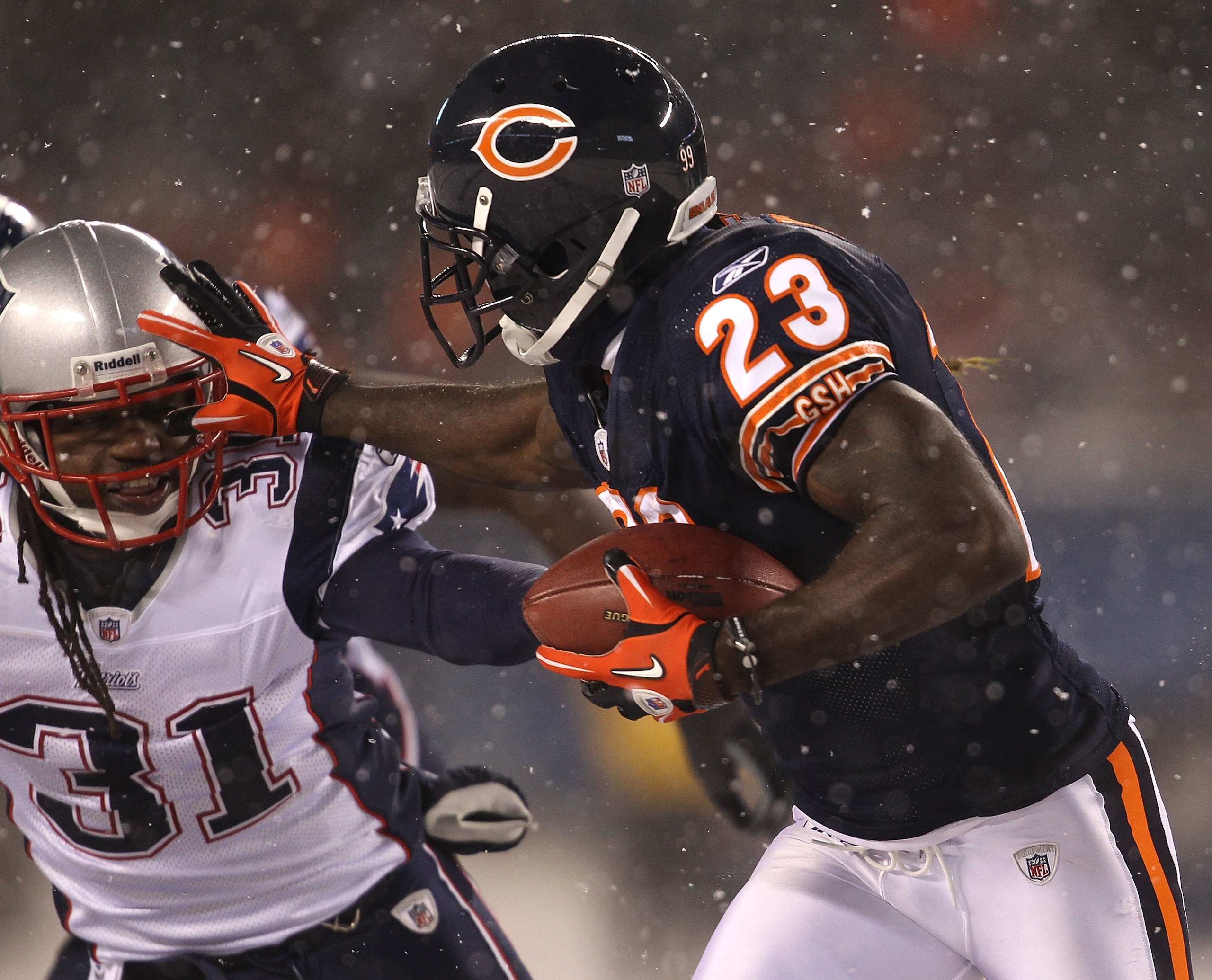CHICAGO - DECEMBER 12: Devin Hester #23 of the Chicago Bears runs against Brandon Meriweather #31 of the New England Patriots at Soldier Field on December 12, 2010 in Chicago, Illinois. The Patriots defeated the Bears 36-7. (Photo by Jonathan Daniel/Getty