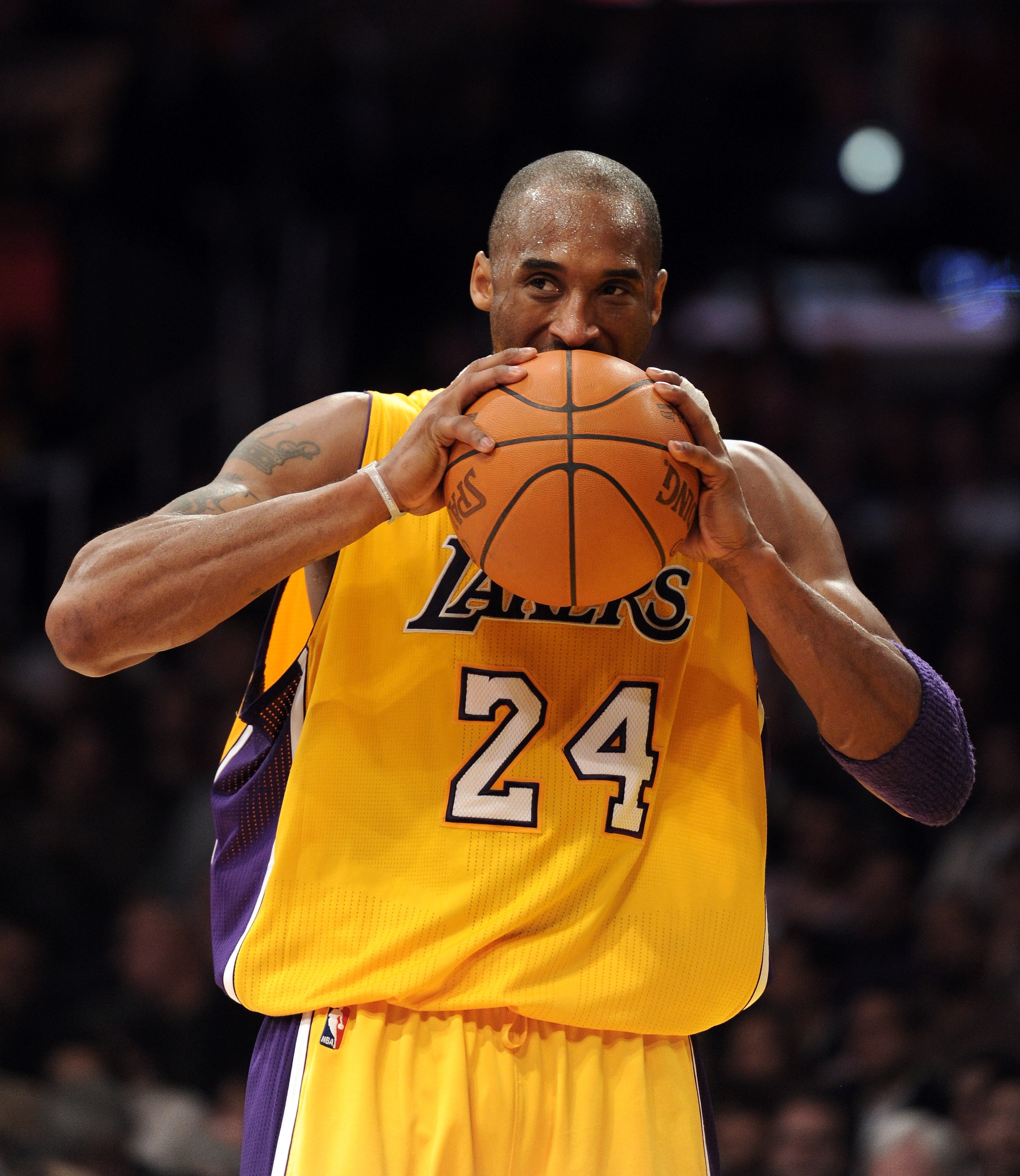 LOS ANGELES, CA - JANUARY 04:  Kobe Bryant #24 of the Los Angeles Lakers bites the basketball in reaction to a basket during a 108-83 win over the Detroit Pistons at the Staples Center on January 4, 2011 in Los Angeles, California. NOTE TO USER: User expr
