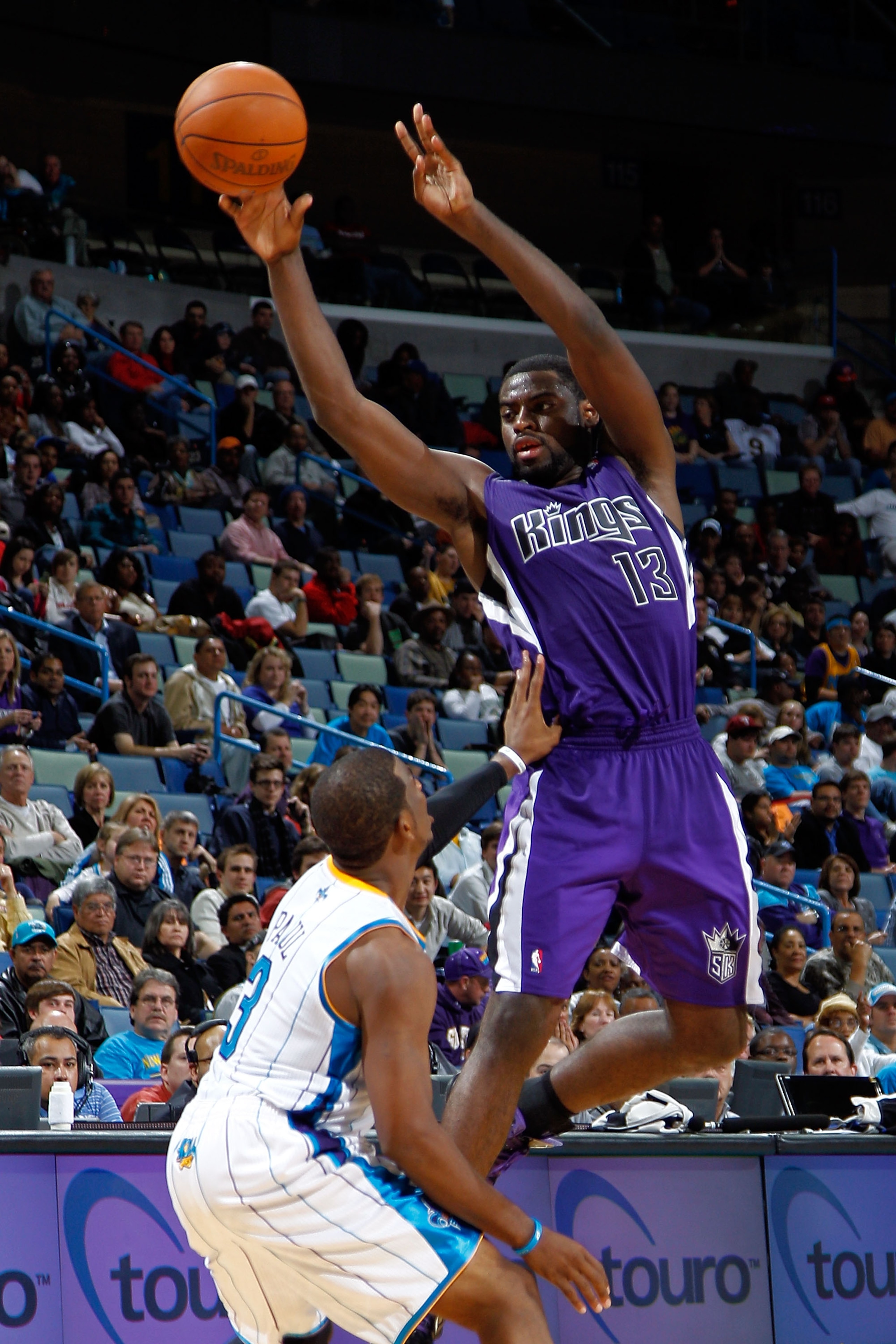 NEW ORLEANS, LA - DECEMBER 15:  Tyreke Evans #13 of the Sacramento Kings passes the ball over Chris Paul #3 of the New Orleans Hornets  at the New Orleans Arena on December 15, 2010 in New Orleans, Louisiana.  The Hornets defeated the Kings 94-91.  NOTE T