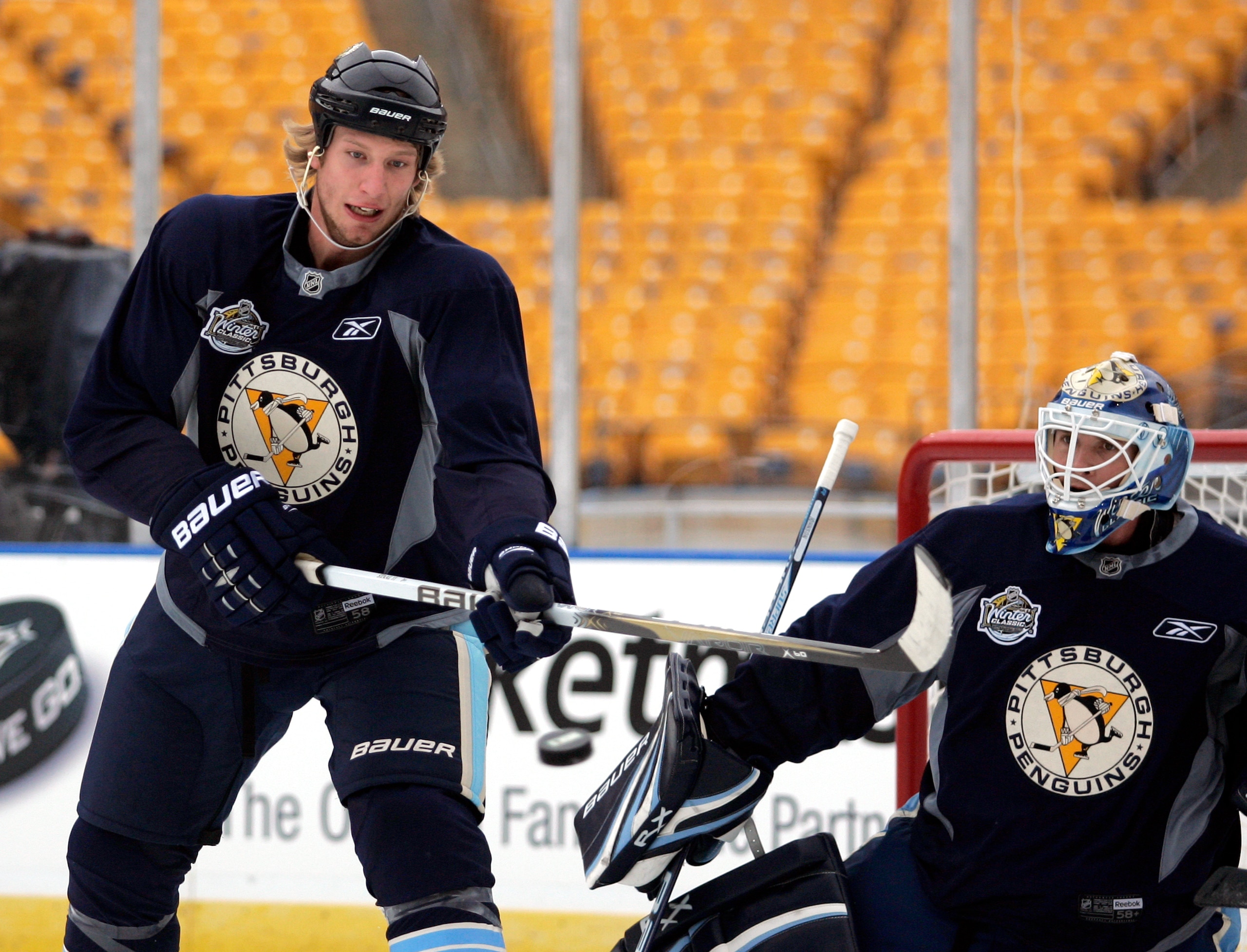 PITTSBURGH, PA - DECEMBER 31:  Jordan Staal #11 of the Pittsburgh Penguins deflects a puck on Brent Johnson #1 during the 2011 NHL Winter Classic Practice on December 31, 2010 at Heinz Field in Pittsburgh, Pennsylvania.  (Photo by Justin K. Aller/Getty Im