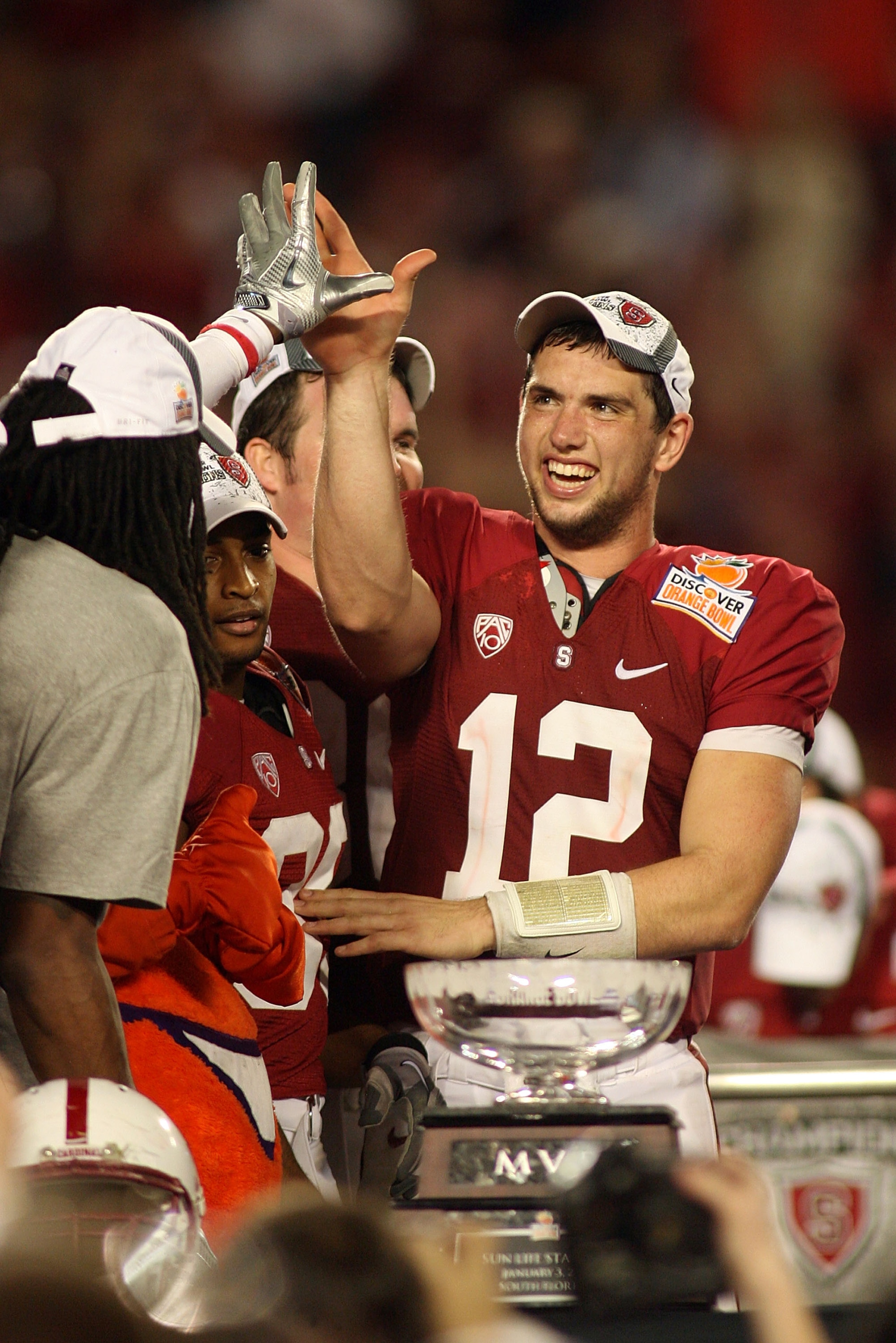 MIAMI, FL - JANUARY 03: Orange Bowl MVP Andrew Luck #12 of the Stanford Cardinal celebrates with his teammates after Stanford won 40-12 against the Virginia Tech Hokies during the 2011 Discover Orange Bowl at Sun Life Stadium on January 3, 2011 in Miami,