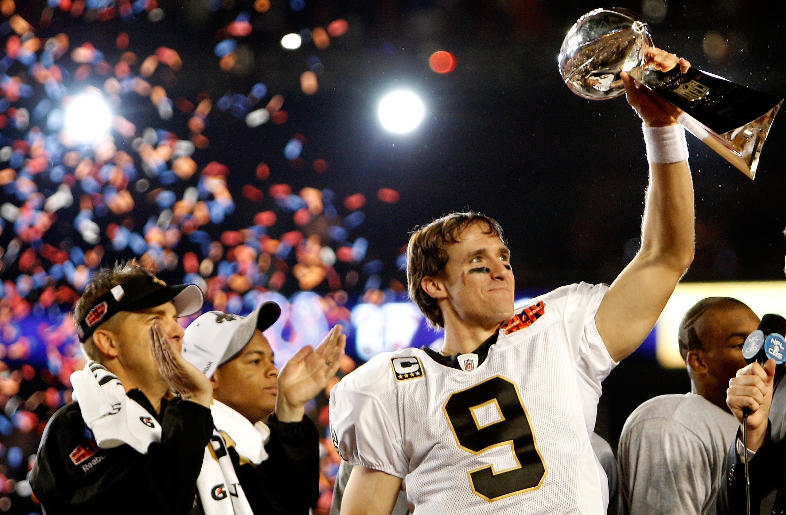MIAMI GARDENS, FL - FEBRUARY 07:  Quarterback Drew Brees #9 of the New Orleans Saints celebrates with the Vince Lombardi Trophy after his team defeated the Indianapolis Colts during Super Bowl XLIV on February 7, 2010 at Sun Life Stadium in Miami Gardens,
