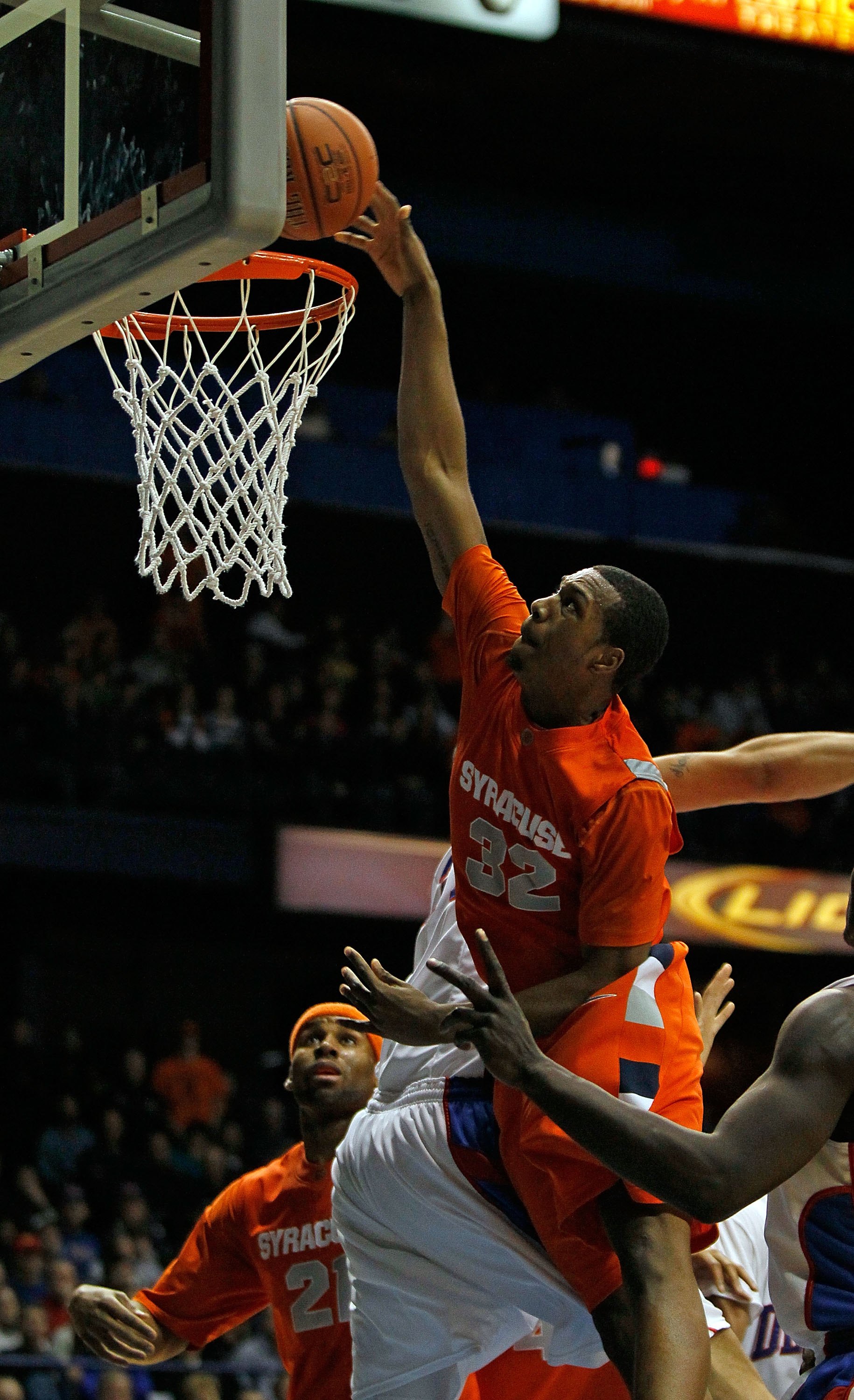 ROSEMONT, IL - JANUARY 30: Kris Joseph #32 of the Syracuse Orange puts up a shot over Kris Faber #33 of the DePaul Blue Demons at the Allstate Arena on January 30, 2010 in Rosemont, Illinois. Syracuse defeated DePaul 59-57. (Photo by Jonathan Daniel/Getty