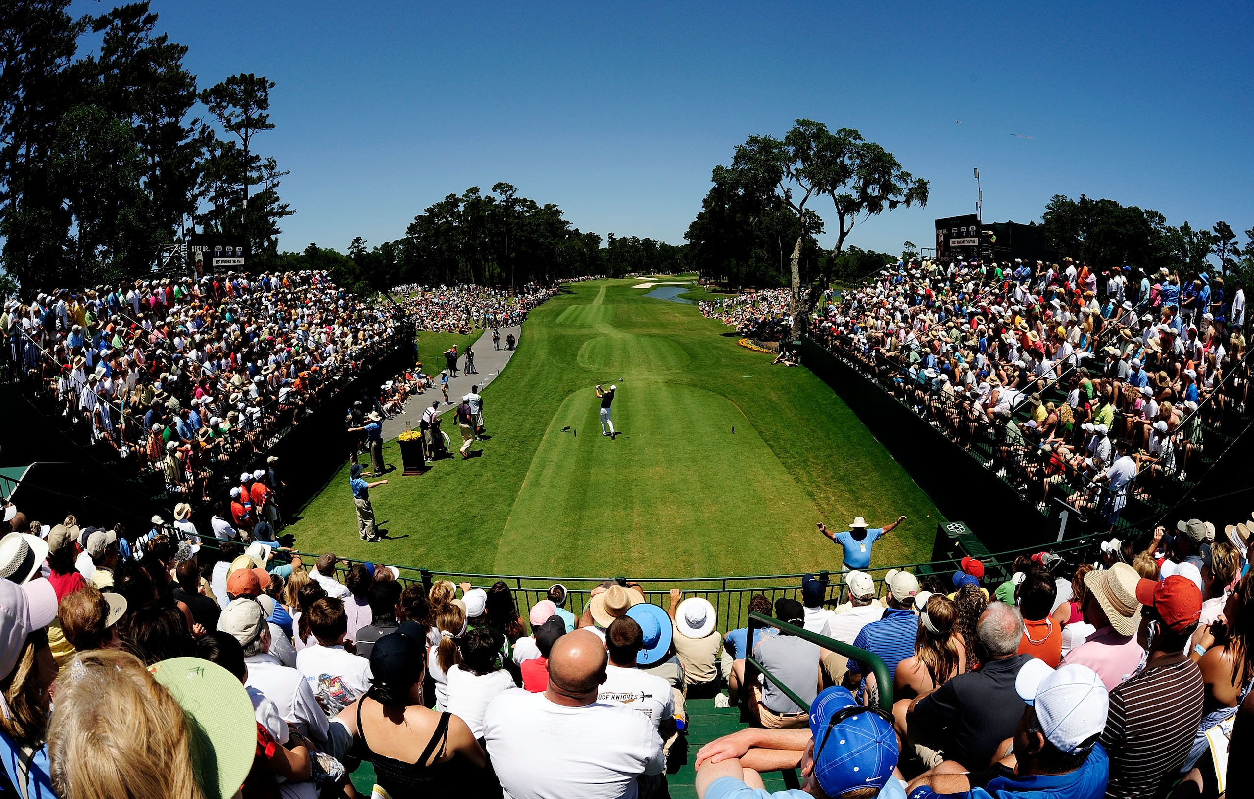 PONTE VEDRA BEACH, FL - MAY 09:  Zach Johnson plays his tee shot on the first hole as Phil Mickelson looks on during the final round of THE PLAYERS Championship held at THE PLAYERS Stadium course at TPC Sawgrass on May 9, 2010 in Ponte Vedra Beach, Florid