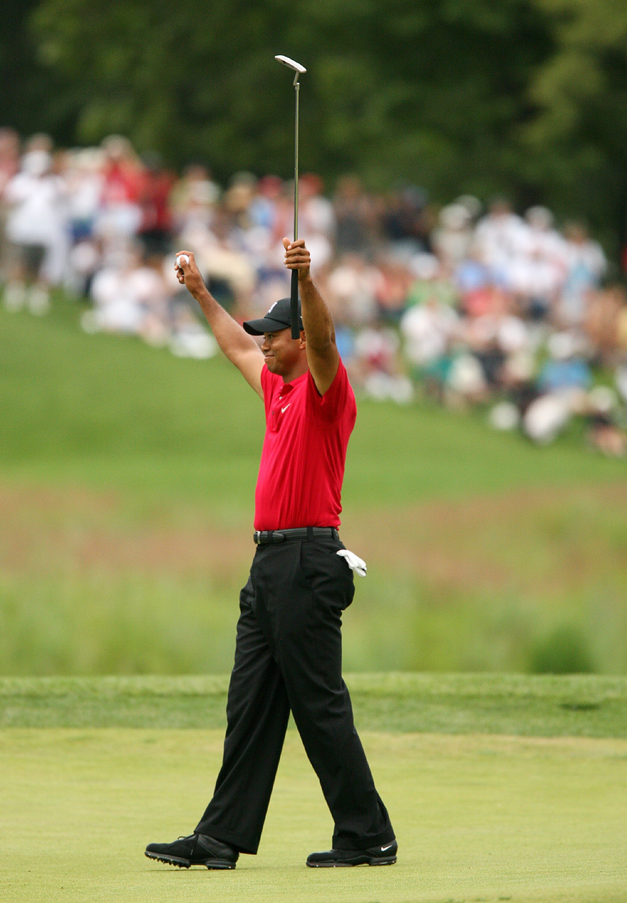 BETHESDA, MD - JULY 5 : Tiger Woods celebrates on the 18th hole after winning the the AT&T National hosted by Tiger Woods at Congressional Country Club on July 5, 2009 in Bethesda, Maryland. (Photo by Hunter Martin/Getty Images)