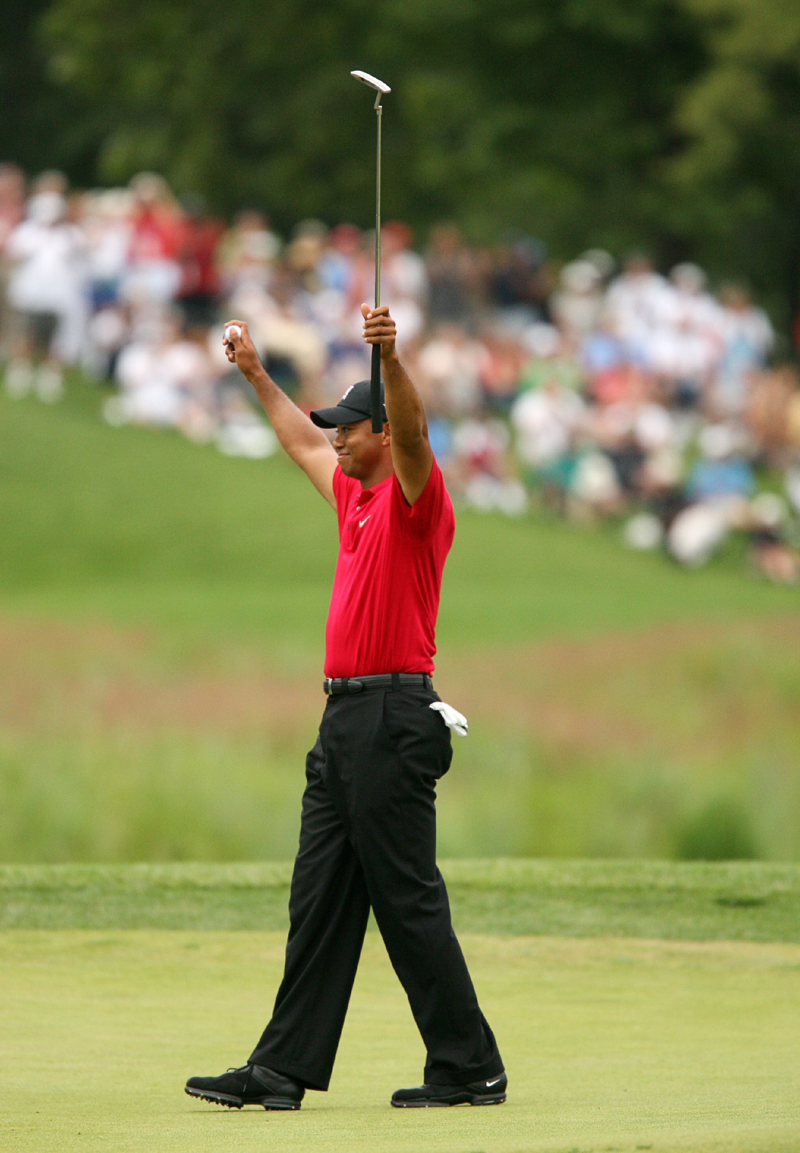 BETHESDA, MD - JULY 5 : Tiger Woods celebrates on the 18th hole after winning the the AT&T National hosted by Tiger Woods at Congressional Country Club on July 5, 2009 in Bethesda, Maryland. (Photo by Hunter Martin/Getty Images)