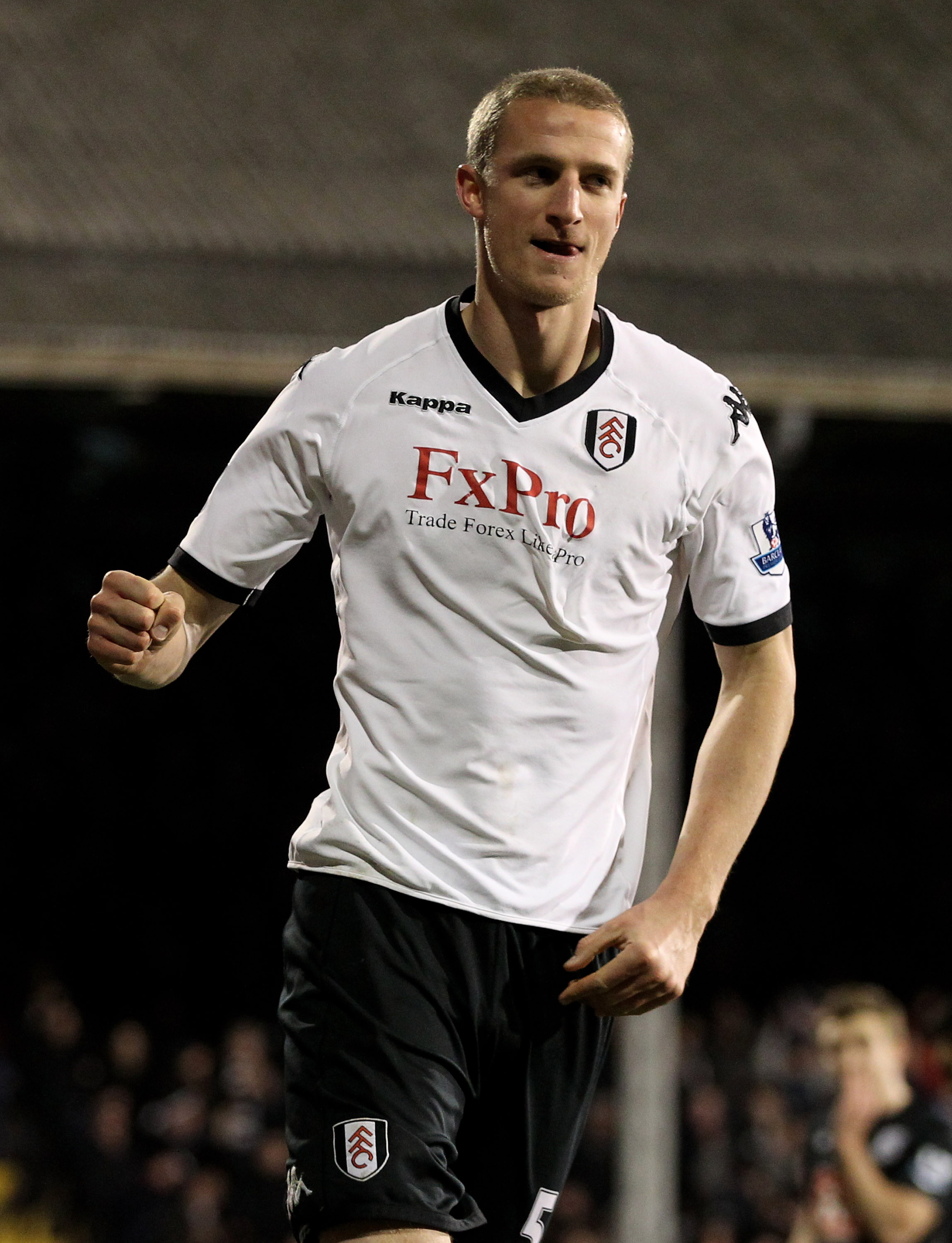 LONDON, ENGLAND - JANUARY 04:  Brede Hangeland of Fulham celebrates after scoring their third goal during the Barclays Premier League match between Fulham and West Bromwich Albion at Craven Cottage on January 4, 2011 in London, England.  (Photo by Scott H